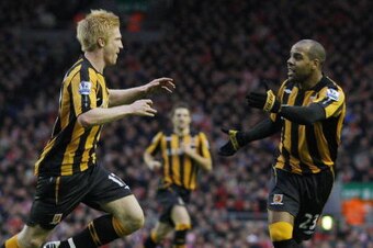 Hull City's Irish defender Paul McShane (L) celebrates scoring the opening goal against Liverpool during their English Premier League football match at Anfield in Liverpool, north west England on December 13 2008. AFP PHOTO/PAUL ELLIS - FOR EDITORIAL USE 