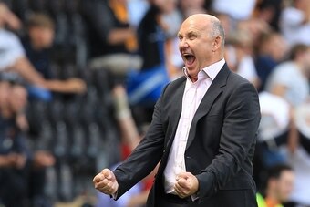 Hull City's caretaker manager Mike Phelan celebrates Hull City's victory at the final whistle of the English Premier League football match between Hull City and Leicester City at the KCOM Stadium in Kingston upon Hull, north east England on August 13, 201