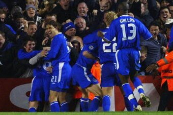 LONDON - APRIL 6:  Wayne Bridge of Chelsea celebrates scoring their winning goal with the fans and his team mates during the UEFA Champions League Quarter Final Second Leg match between Arsenal and Chelsea at Highbury on March 6, 2004 in London.  (Photo b