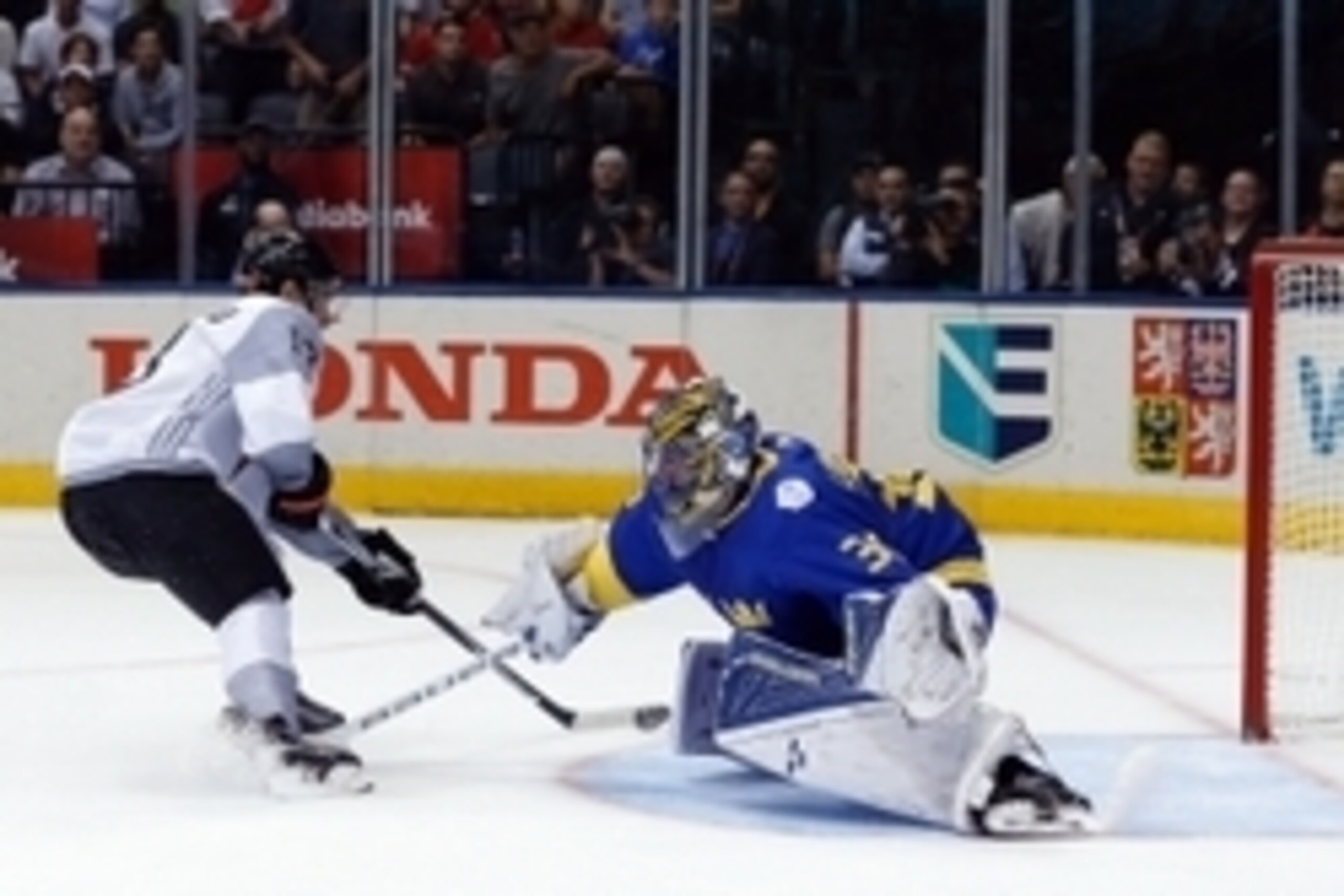 Sep 21, 2016; Toronto, Ontario, Canada; Team North America left winger Johnny Gaudreau (13) beats Team Sweden goaltender Henrik Lundqvist (30) to score in the first period during preliminary round play in the 2016 World Cup of Hockey at Air Canada Centre.
