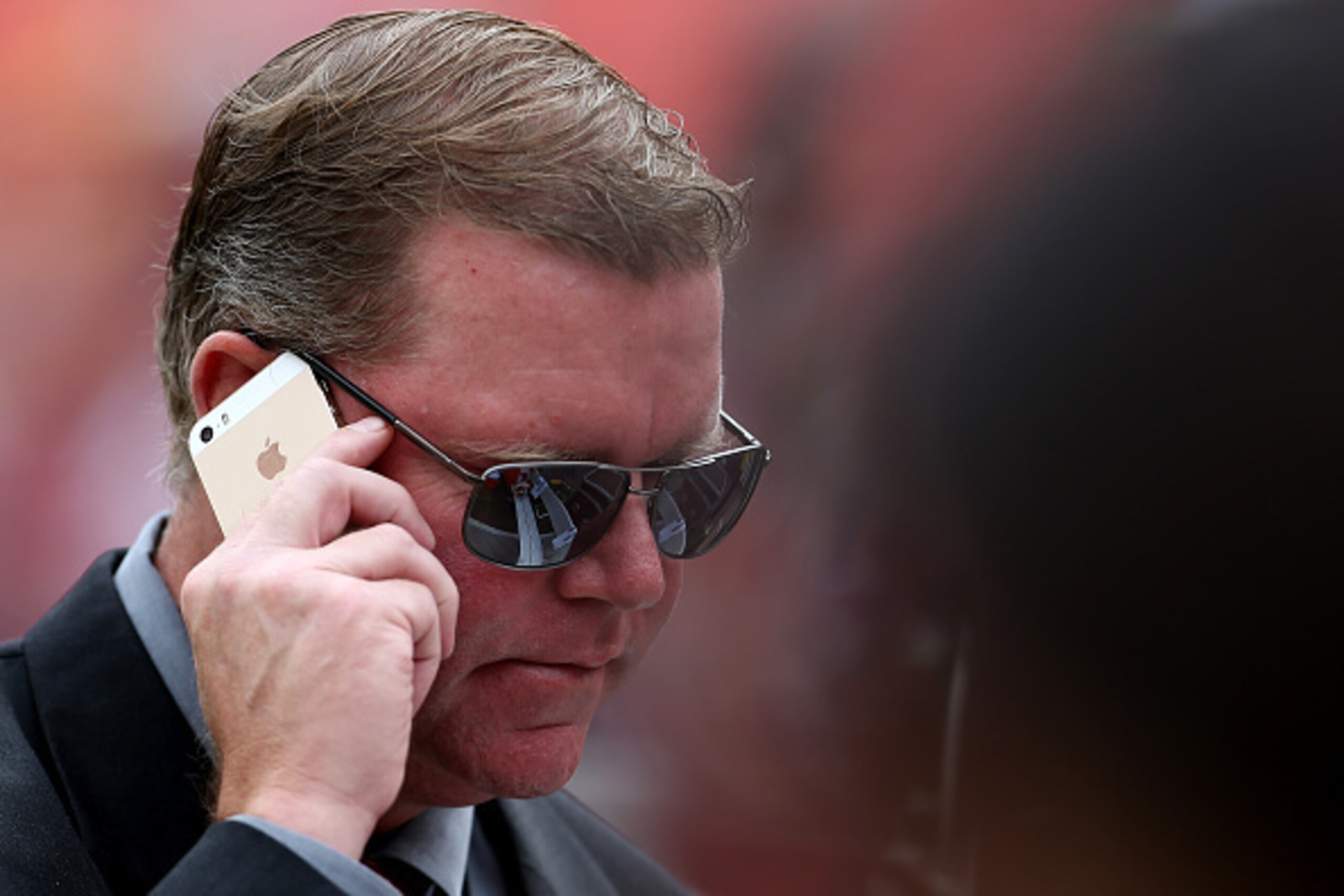 LANDOVER, MD - SEPTEMBER 20: General Manager Scot McCloughan of the Washington Redskins talks on the phone prior to the start of a game against the St. Louis Rams at FedExField on September 20, 2015 in Landover, Maryland. (Photo by Matt Hazlett/Getty Imag