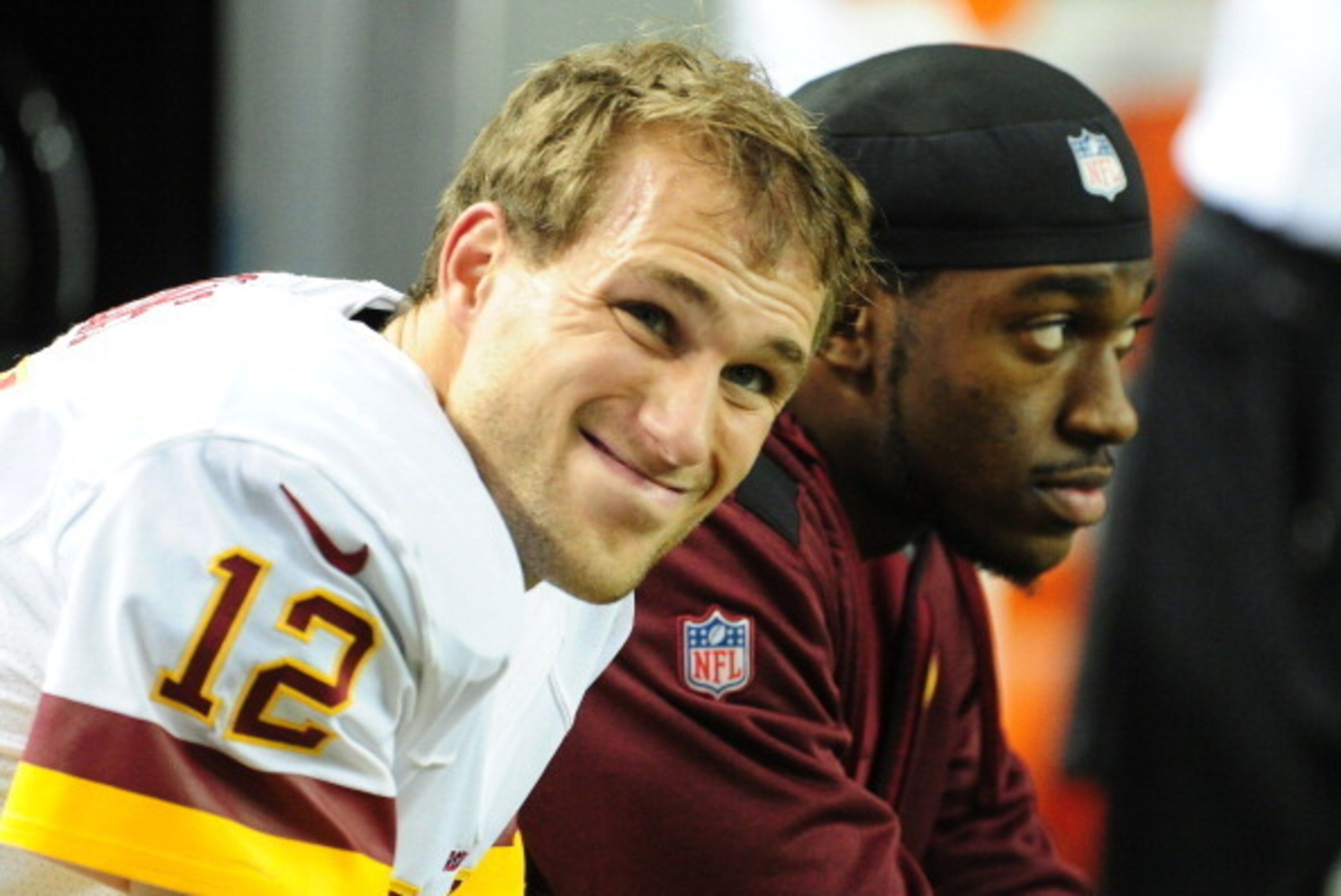 ATLANTA, GA - DECEMBER 15: Kirk Cousins #12 of the Washington Redskins chats with Robert Griffin III after throwing a 4th quarter interception against the Atlanta Falcons at the Georgia Dome on December 15, 2013 in Atlanta, Georgia. (Photo by Scott Cunnin