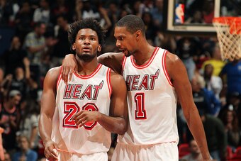 MIAMI, FL - FEBRUARY 7: Justise Winslow #20 and Chris Bosh #1 of the Miami Heat discuss during the game against the Los Angeles Clippers on February 7, 2016 at AmericanAirlines Arena in Miami, Florida. NOTE TO USER: User expressly acknowledges and agrees 
