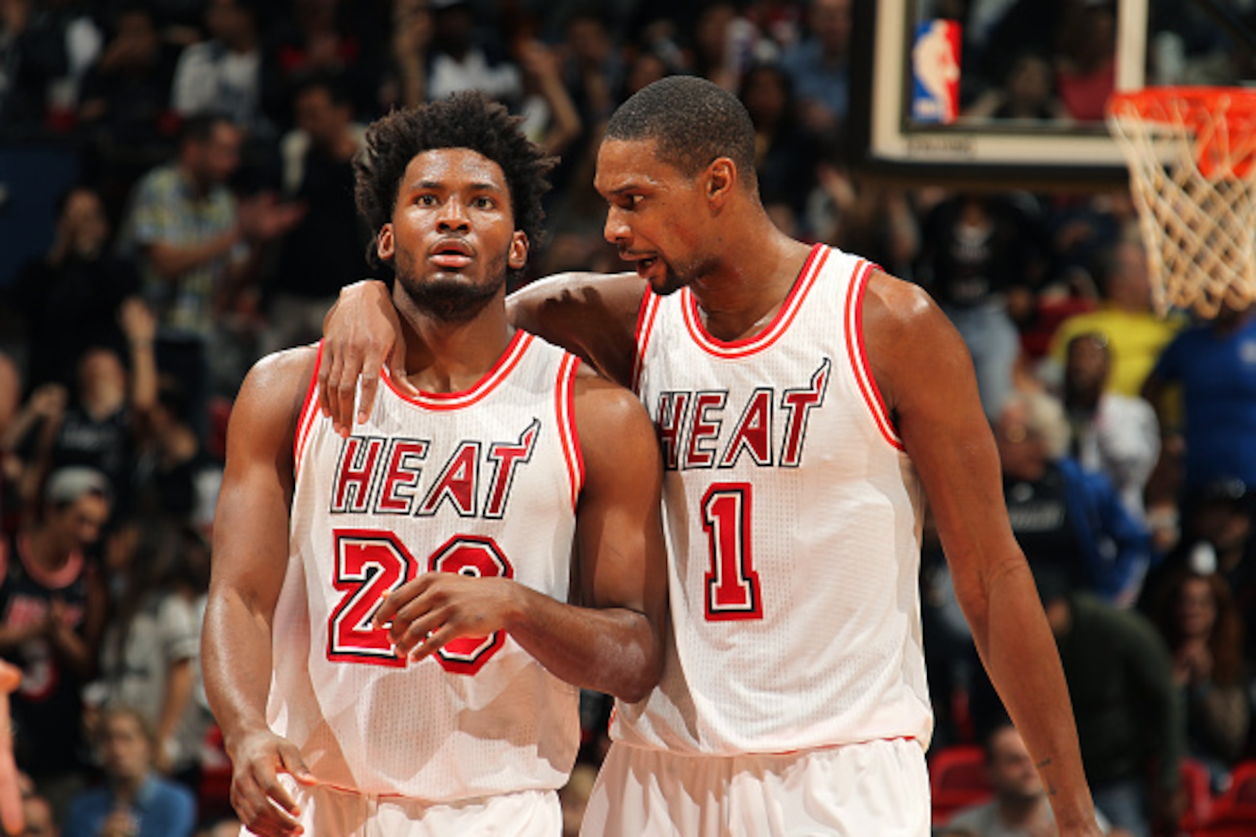 MIAMI, FL - FEBRUARY 7: Justise Winslow #20 and Chris Bosh #1 of the Miami Heat discuss during the game against the Los Angeles Clippers on February 7, 2016 at AmericanAirlines Arena in Miami, Florida. NOTE TO USER: User expressly acknowledges and agrees 