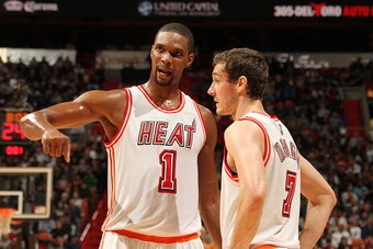 MIAMI, FL - FEBRUARY 9:  Chris Bosh #1 of the Miami Heat talks with Goran Dragic #7 of the Miami Heat during the game against the San Antonio Spurs on February 9, 2016 at American Airlines Arena in Miami, Florida. NOTE TO USER: User expressly acknowledges