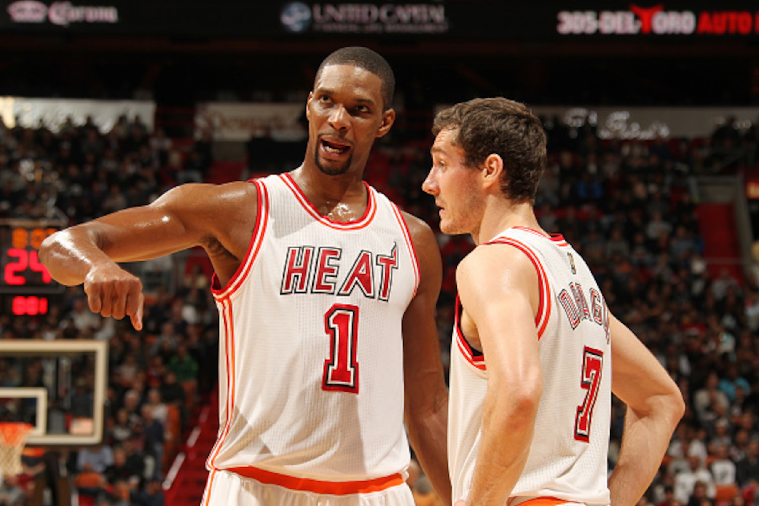 MIAMI, FL - FEBRUARY 9:  Chris Bosh #1 of the Miami Heat talks with Goran Dragic #7 of the Miami Heat during the game against the San Antonio Spurs on February 9, 2016 at American Airlines Arena in Miami, Florida. NOTE TO USER: User expressly acknowledges