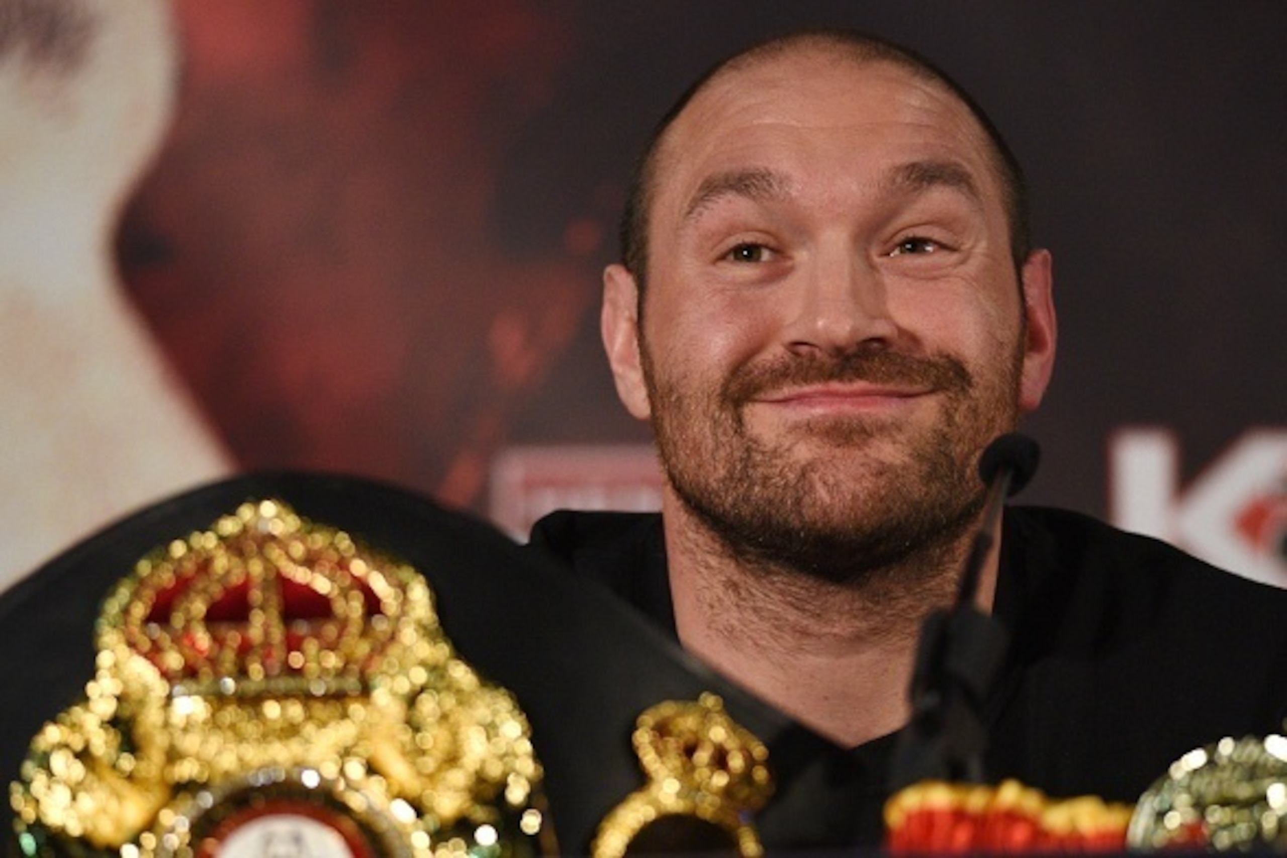 British heavyweight boxer Tyson Fury reacts during a press conference to publicise his forthcoming world heavyweight title fight against Ukranian heavyweight Wladimir Klitschko, at the Manchester Arena in Manchester, north-west England on April 27, 2016.
