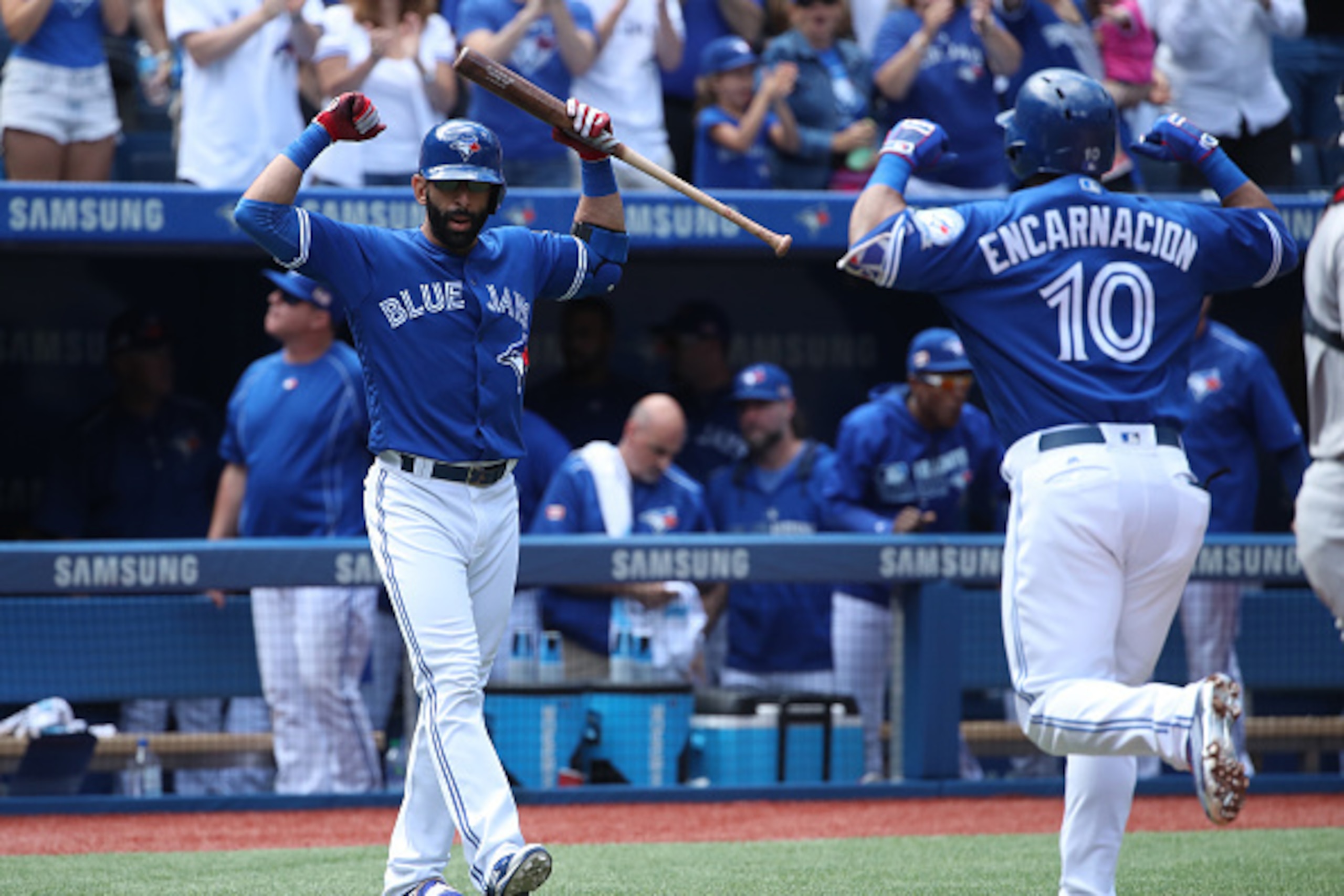 TORONTO, CANADA - SEPTEMBER 11: Edwin Encarnacion #10 of the Toronto Blue Jays is congratulated by Jose Bautista #19 after hitting a solo home run in the first inning during MLB game action against the Boston Red Sox on September 11, 2016 at Rogers Centre