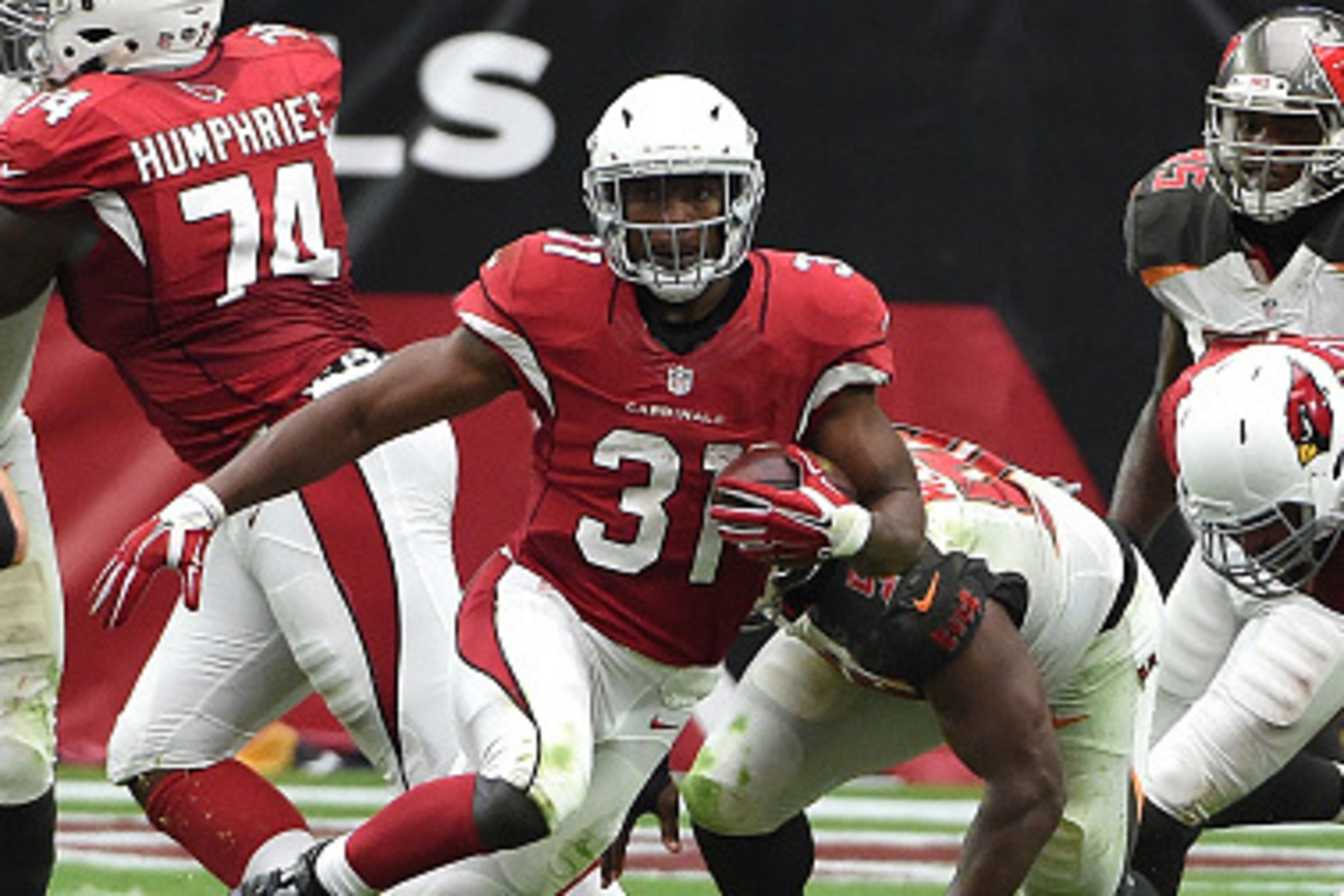 GLENDALE, AZ - SEPTEMBER 18: Running back David Johnson #31 of the Arizona Cardinals runs up field during the second quarter of the NFL game against the Tampa Bay Buccaneers at University of Phoenix Stadium on September 18, 2016 in Glendale, Arizona.  (Ph