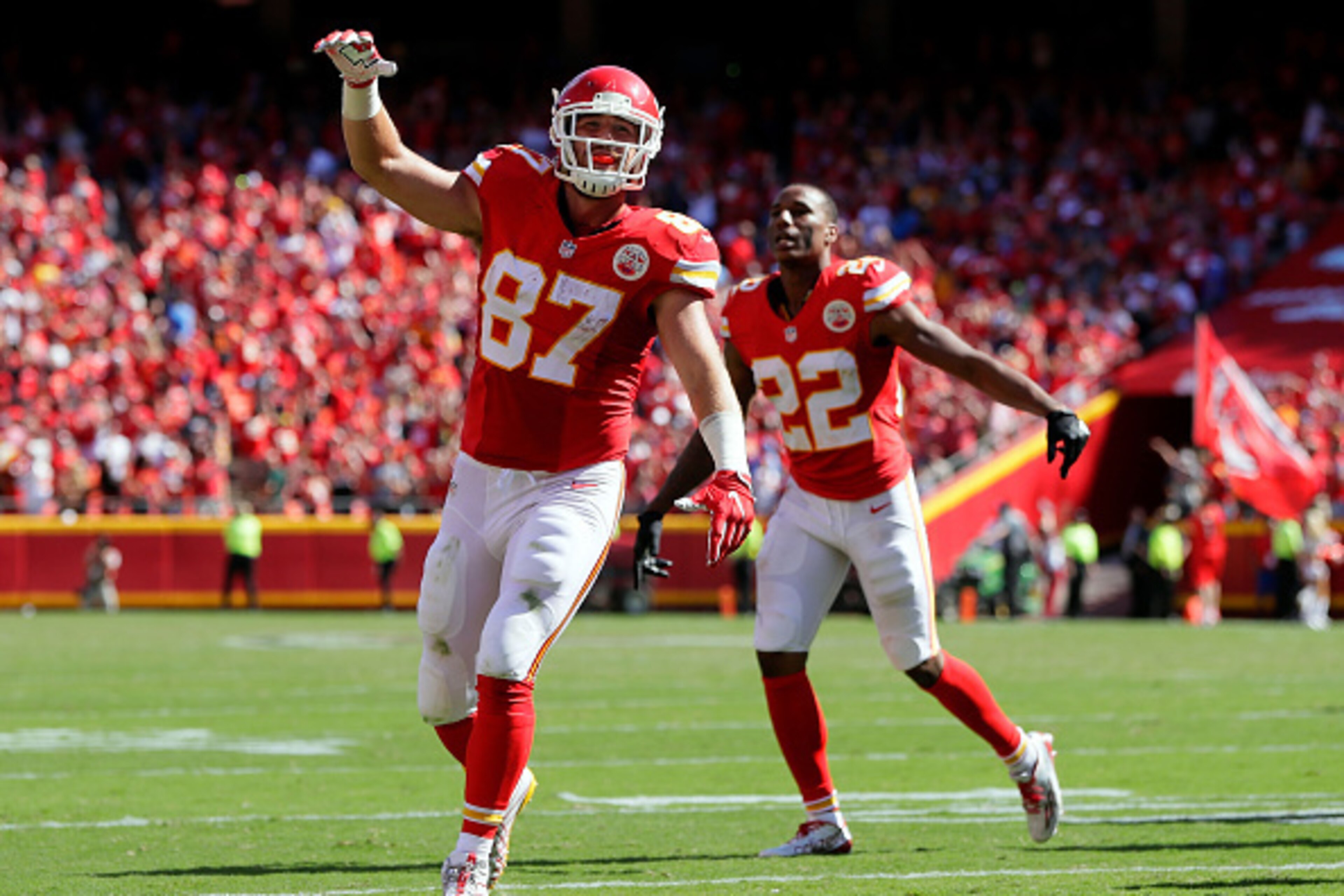 KANSAS CITY, MO - SEPTEMBER 11:  Travis Kelce #87 and Marcus Peters #22 of the Kansas City Chiefs celebrate as the Chiefs defeat the San Diego Chargers to win the game at Arrowhead Stadium on September 11, 2016 in Kansas City, Missouri.  (Photo by Jamie S