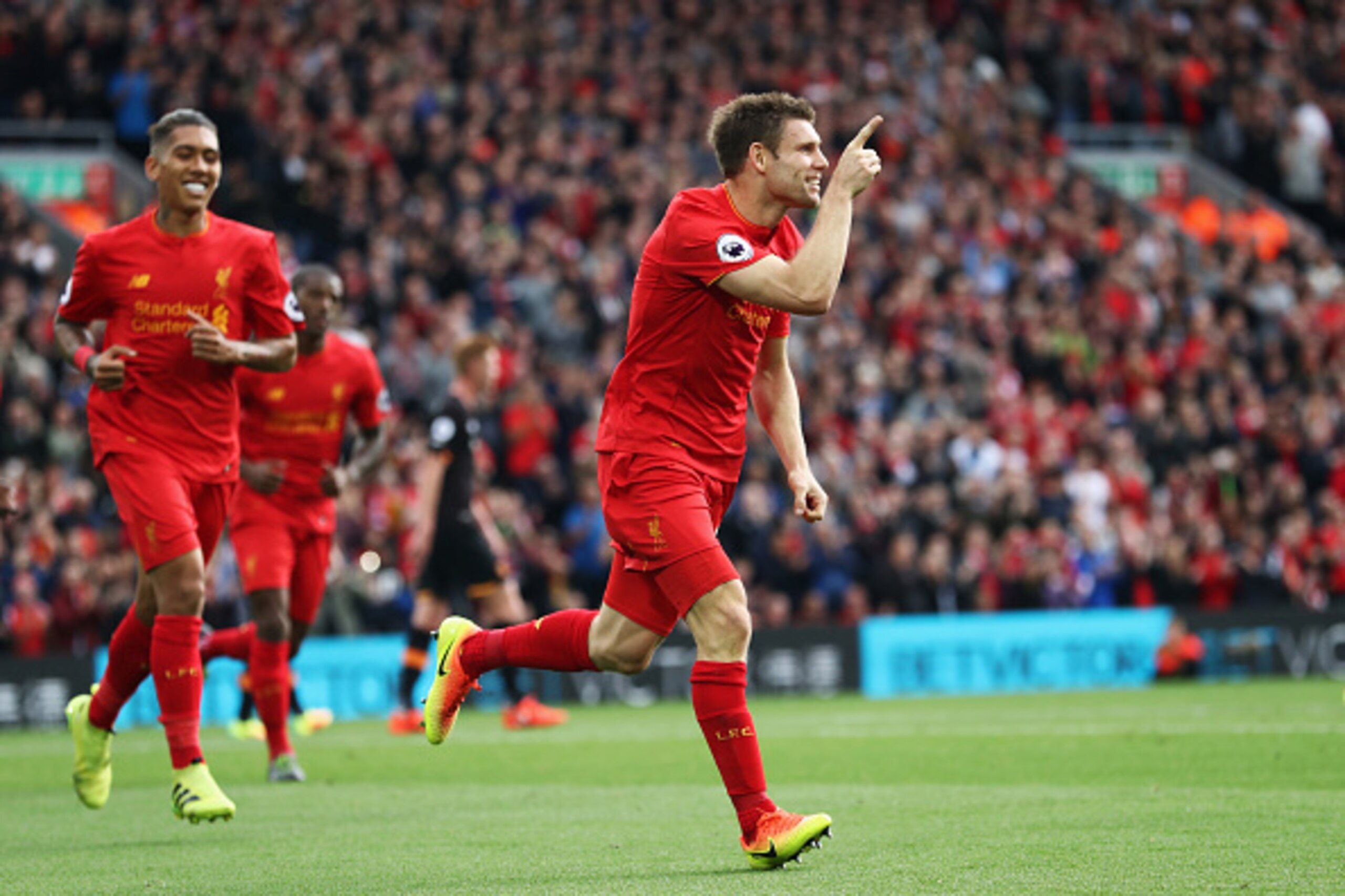 LIVERPOOL, ENGLAND - SEPTEMBER 24: James Milner of Liverpool celebrates scoring his sides second goal during the Premier League match between Liverpool and Hull City at Anfield on September 24, 2016 in Liverpool, England.  (Photo by Julian Finney/Getty Im