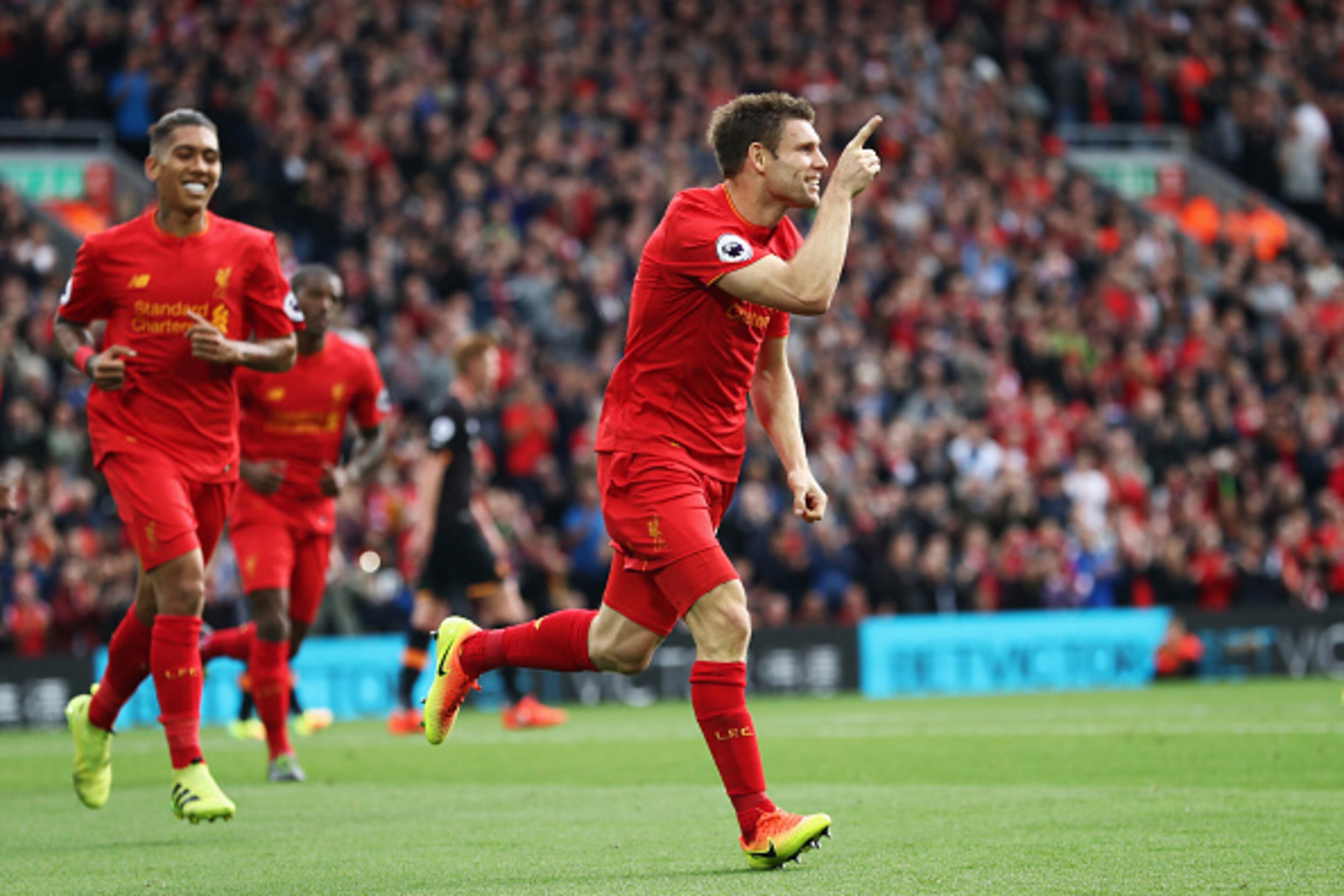 LIVERPOOL, ENGLAND - SEPTEMBER 24: James Milner of Liverpool celebrates scoring his sides second goal during the Premier League match between Liverpool and Hull City at Anfield on September 24, 2016 in Liverpool, England.  (Photo by Julian Finney/Getty Im