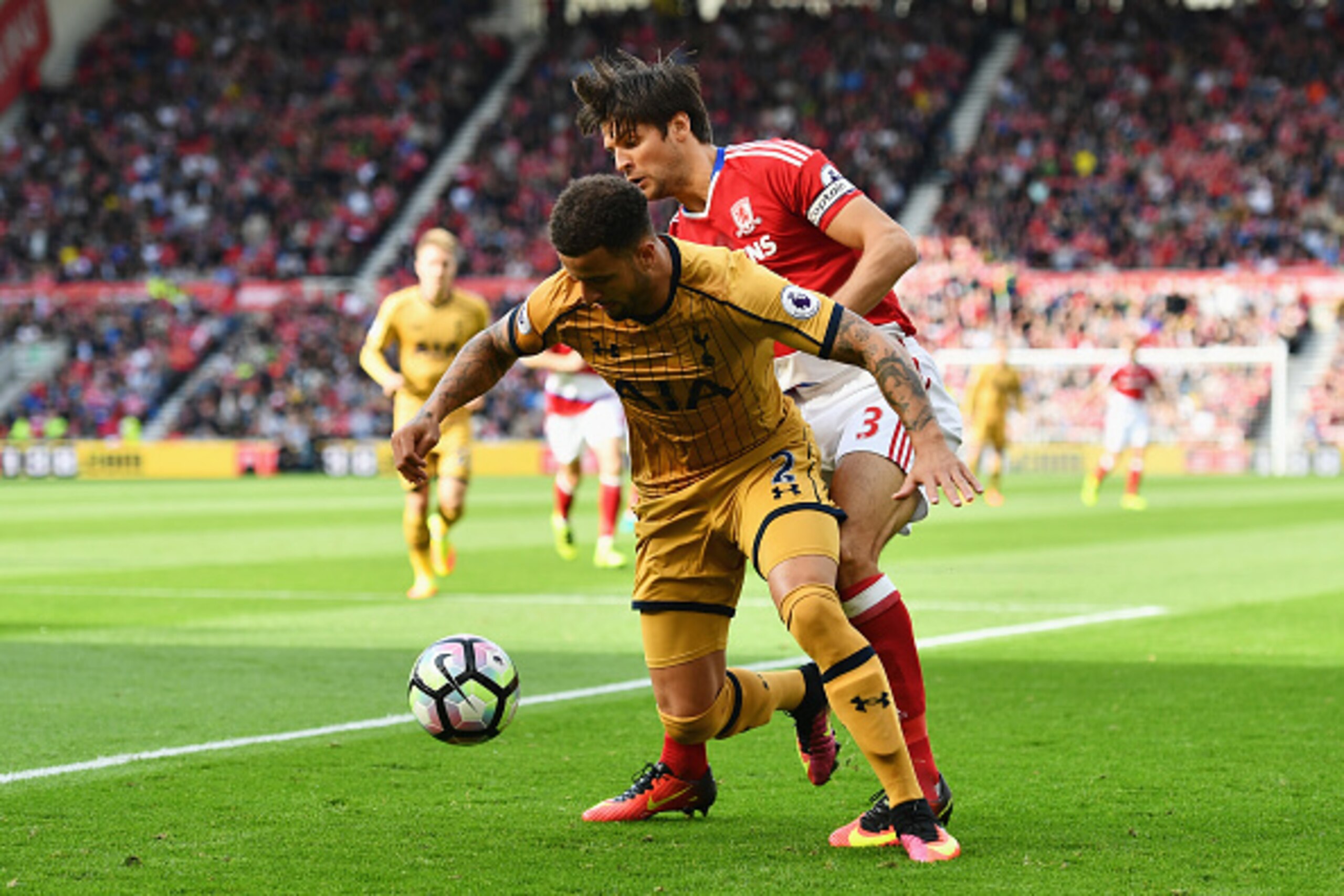 MIDDLESBROUGH, ENGLAND - SEPTEMBER 24:  Kyle Walker of Tottenham Hotspur(L) is put under pressure from George Friend of Middlesbrough (R) during the Premier League match between Middlesbrough and Tottenham Hotspur at the Riverside Stadium on September 24,