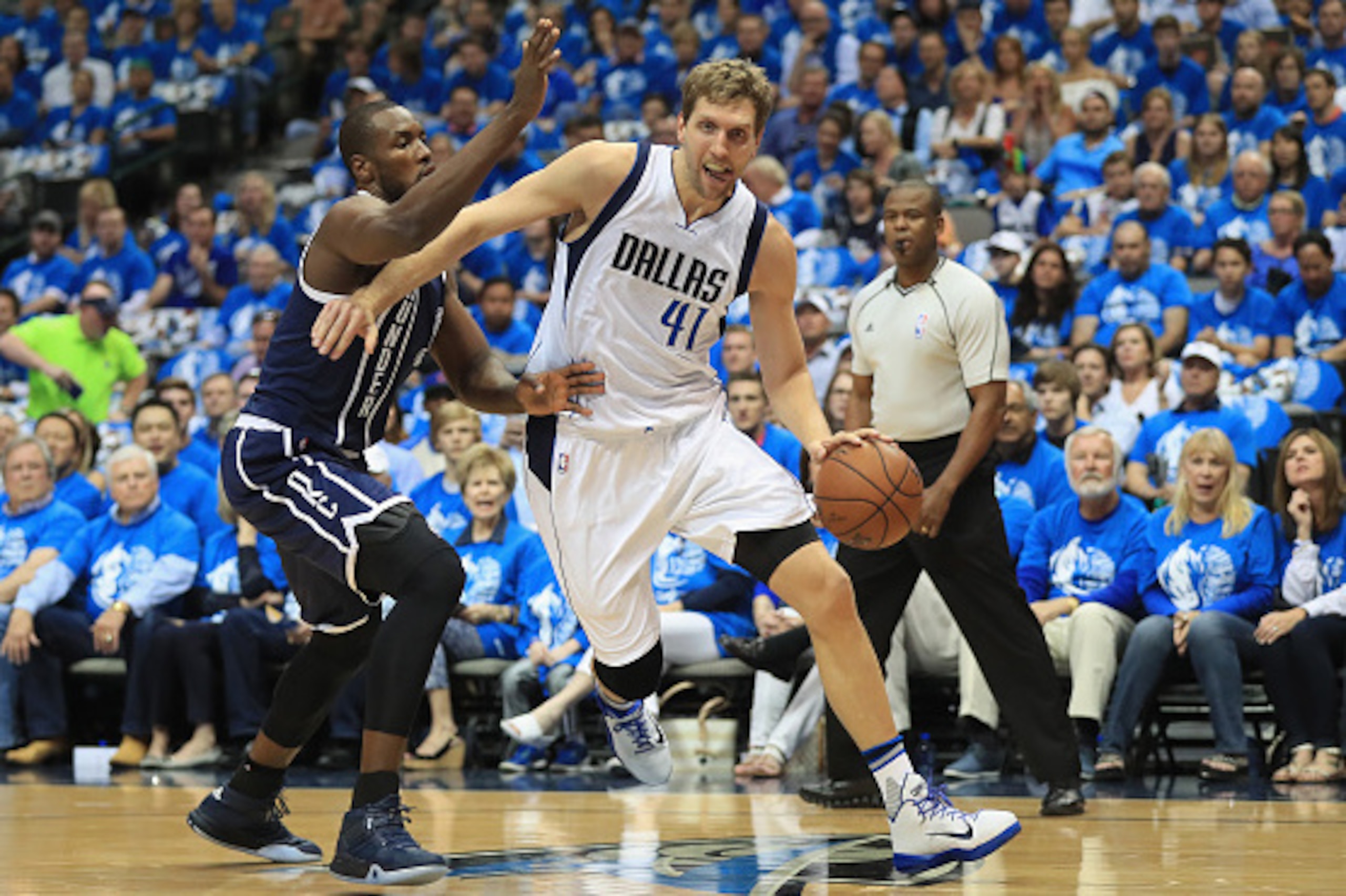 DALLAS, TX - APRIL 21:  Dirk Nowitzki #41 of the Dallas Mavericks dribbles the ball against Serge Ibaka #9 of the Oklahoma City Thunder during game three of the Western Conference Quarterfinals of the 2016 NBA Playoffs at American Airlines Center on April