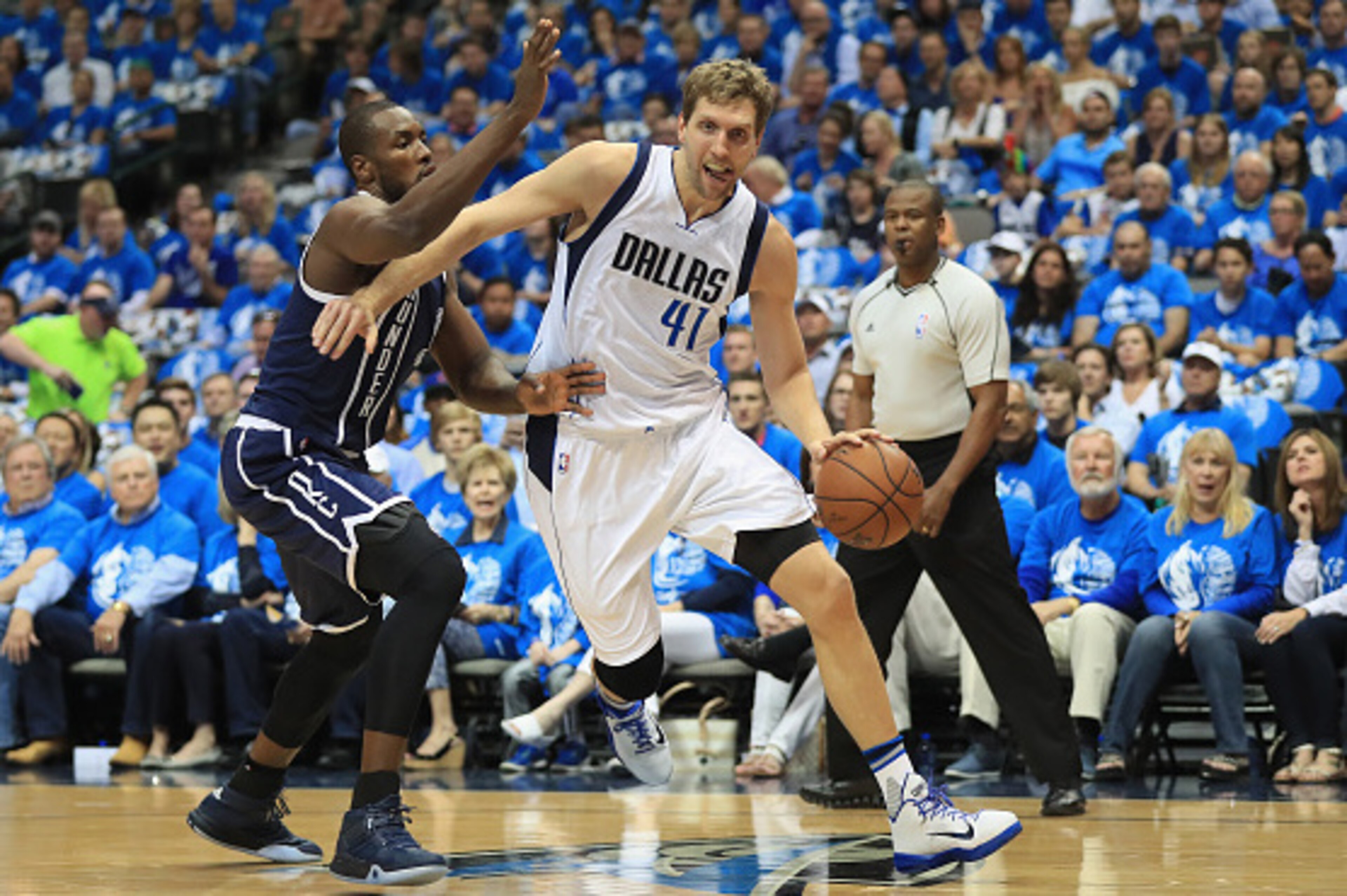 DALLAS, TX - APRIL 21:  Dirk Nowitzki #41 of the Dallas Mavericks dribbles the ball against Serge Ibaka #9 of the Oklahoma City Thunder during game three of the Western Conference Quarterfinals of the 2016 NBA Playoffs at American Airlines Center on April