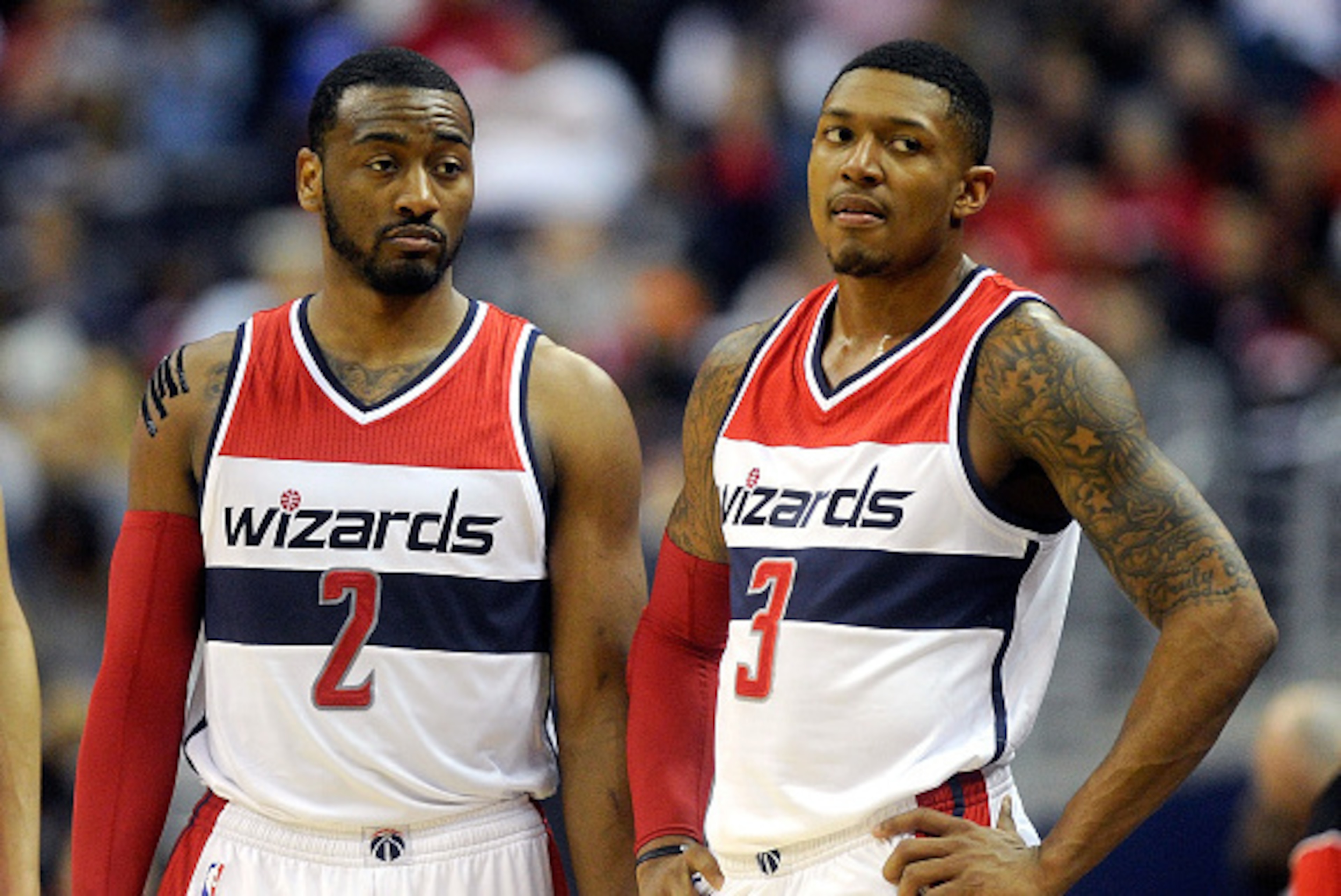 WASHINGTON, DC - APRIL 26:  John Wall #2 and Bradley Beal #3 of the Washington Wizards talk during the game against the Toronto Raptors during Game Four of the Eastern Conference Quarterfinals of the NBA playoffs at Verizon Center on April 26, 2015 in Was