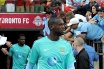 May 27, 2015; Toronto, Ontario, Canada; Manchester City midfielder Yaya Toure (42) walks out past fans for warmup prior to playing Toronto FC in an international club friendly at BMO Field. Mandatory Credit: Dan Hamilton-USA TODAY Sports