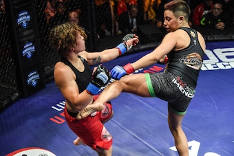 Batara kicks Jenny Silverio.