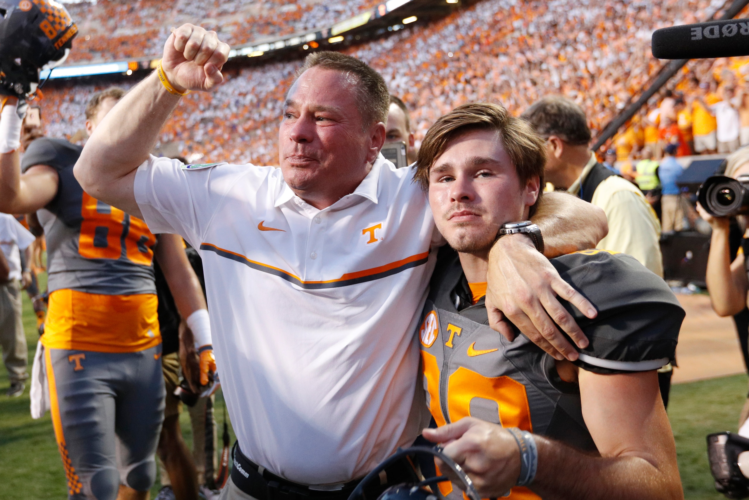 KNOXVILLE, TN - SEPTEMBER 24: Head coach Butch Jones of the Tennessee Volunteers celebrates with his son Alex Jones #39 after the Vols defeated the Florida Gators 38-28 at Neyland Stadium on September 24, 2016 in Knoxville, Tennessee. (Photo by Joe Robbin