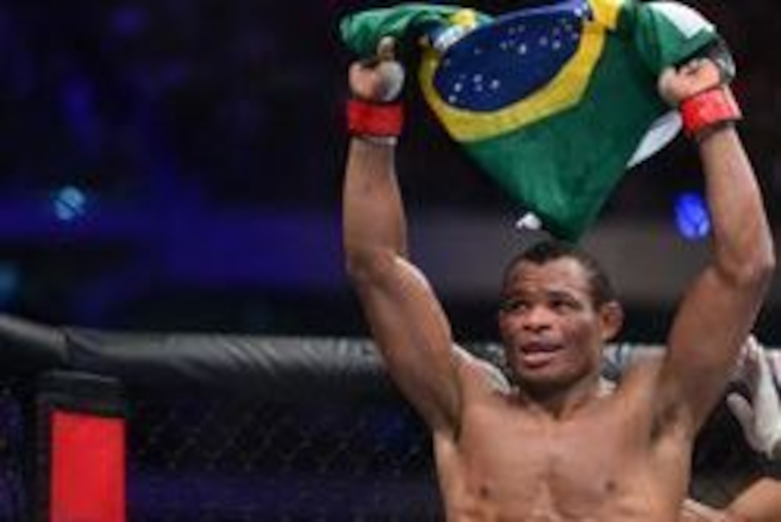 May 14, 2016; Curitiba, Brazil; Francisco Trinaldo (red) celebrates his unanimous decision victory over Yancy Medeiros (not pictured) during UFC Fight Night at Arena Atletico Paranaense. Mandatory Credit: Jason Silva-USA TODAY Sports
