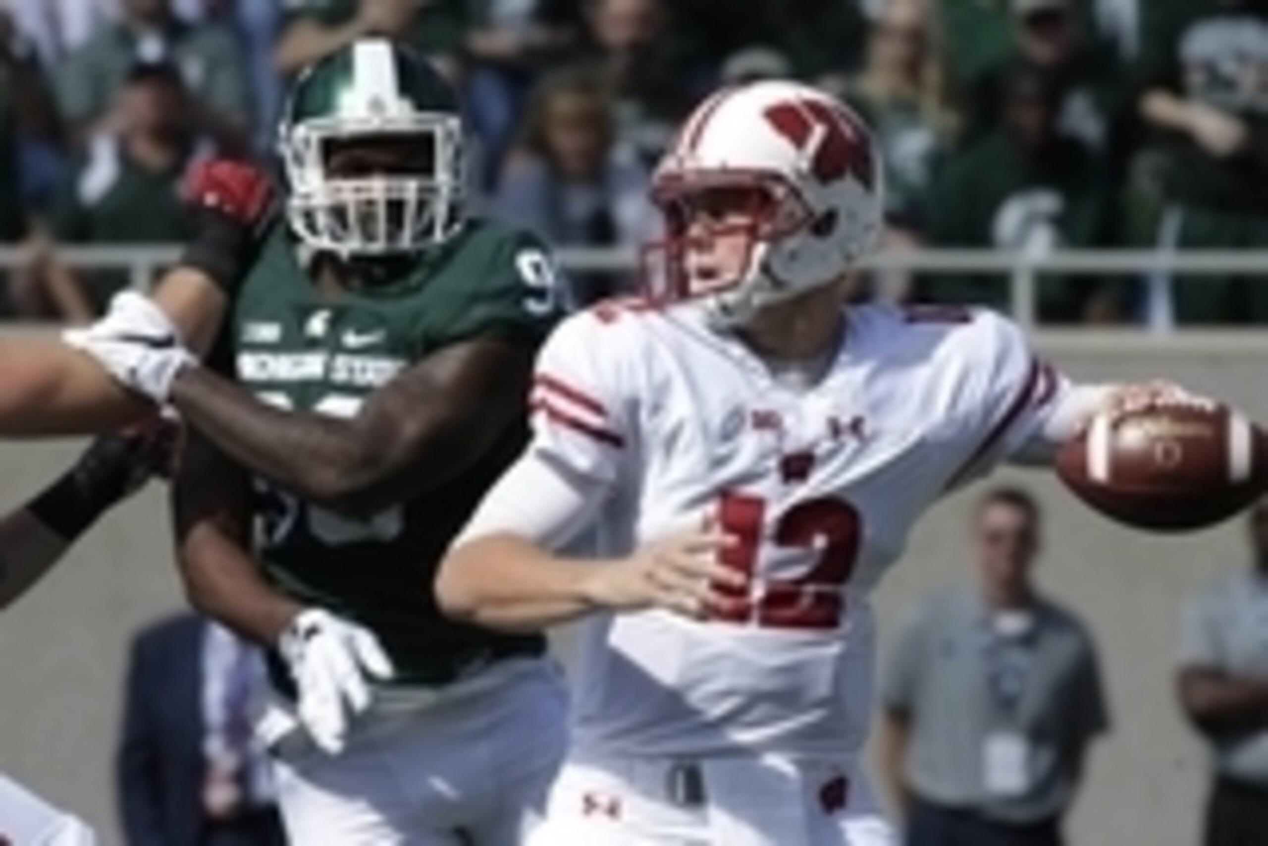 Sep 24, 2016; East Lansing, MI, USA;   Wisconsin quarterback Alex Hornibrook (12) throws a pass during the third quarter of their game against Michigan State at Spartan Stadium. Mandatory Credit: Mark Hoffman/Milwaukee Journal Sentinel via USA TODAY Sport
