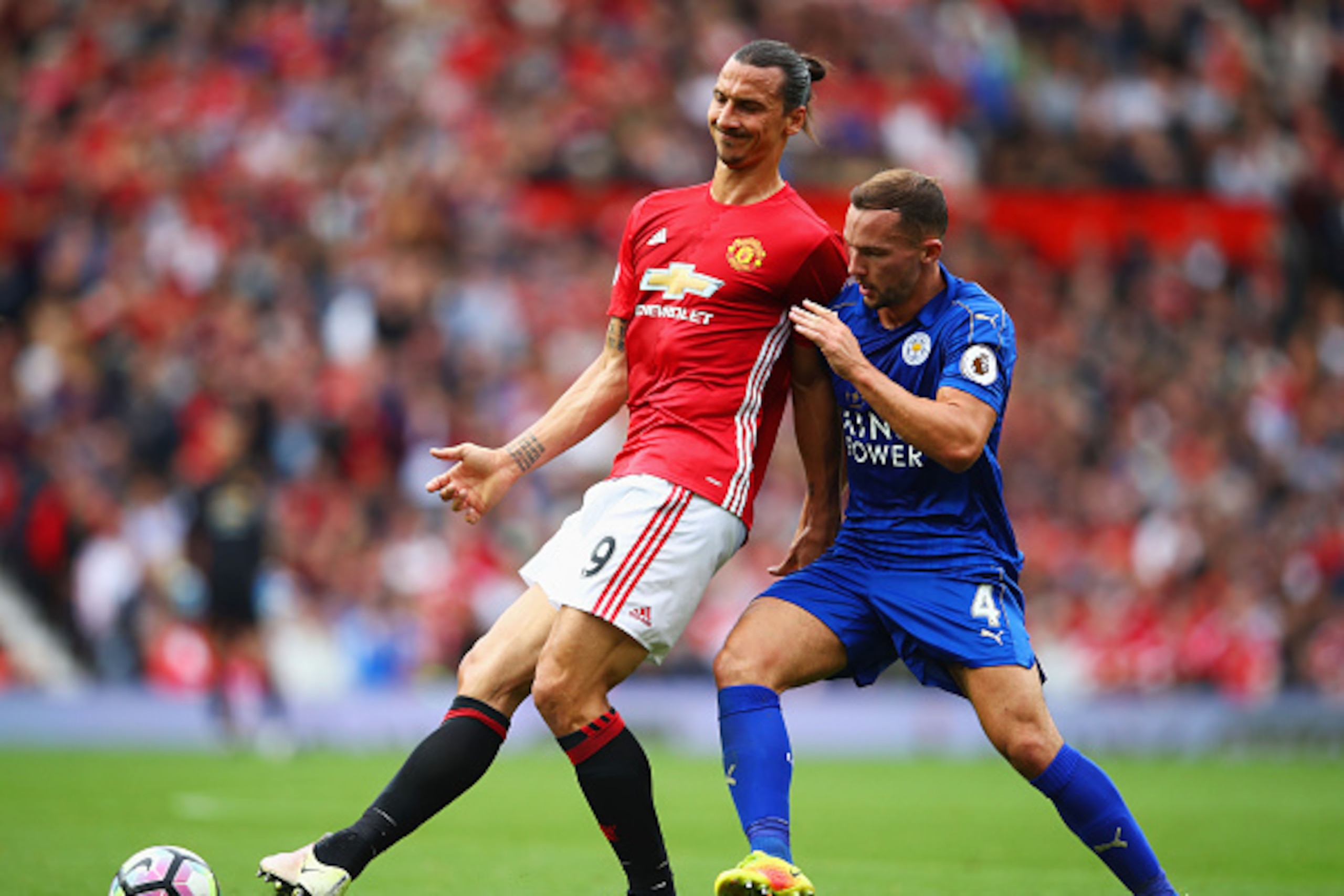 MANCHESTER, ENGLAND - SEPTEMBER 24:  Zlatan Ibrahimovic of Manchester United (L) and Daniel Drinkwater of Leicester City (R) battle for possession  during the Premier League match between Manchester United and Leicester City at Old Trafford on September 2