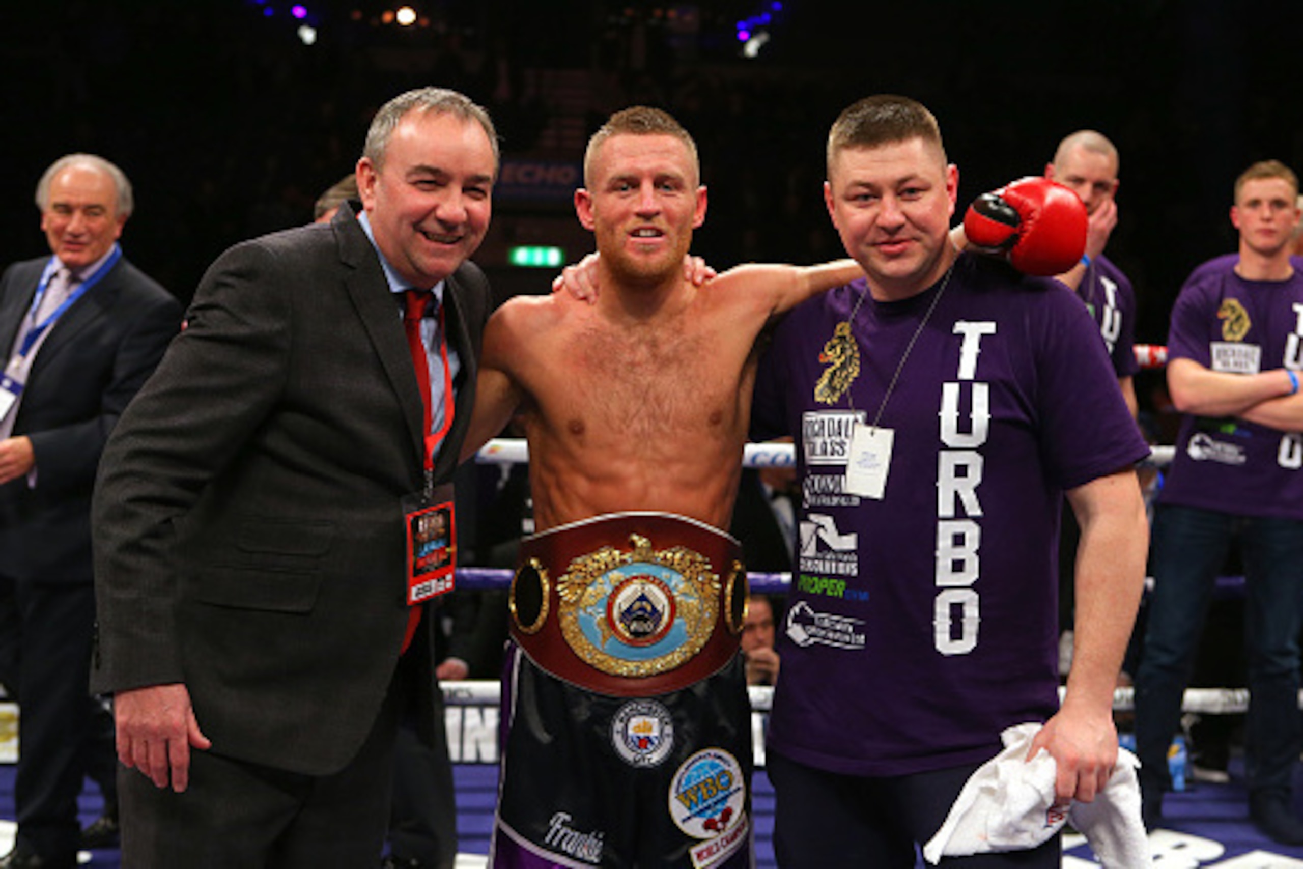 LIVERPOOL, ENGLAND - MARCH 12: Terry Flanagan, trainer Steve Maylett, right, and promoter Steve Wood, left, after victory against Derry Matthews during their WBO World Lightweight Championship bout at the Echo Arena on March 12, 2016 in Liverpool, England
