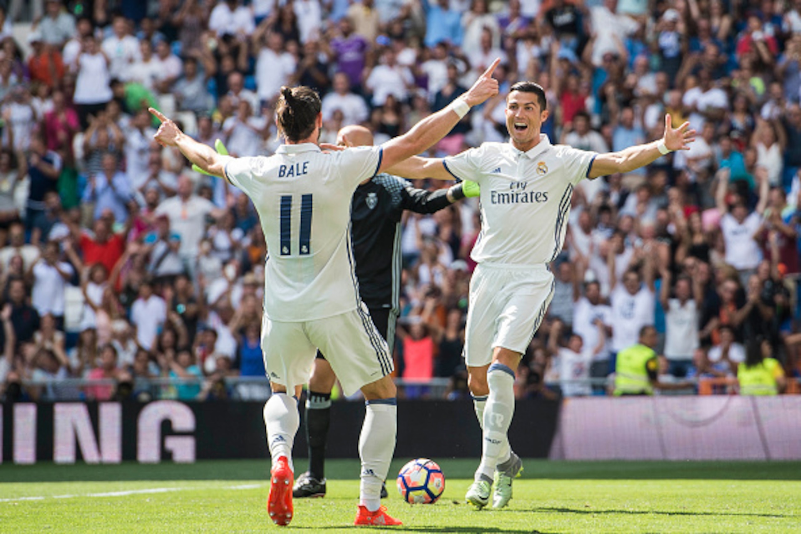 MADRID - SEPTEMBER 10: Cristiano Ronaldo of Real Madrid celebrates with teammate Gareth Bale during the La Liga match between Real Madrid and Osasuna at the Santiago Bernabeu Stadium on 10 September 2016 in Madrid, Spain. (Photo by Power Sport Images/Gett MADRID - SEPTEMBER 10: Cristiano Ronaldo of Real Madrid celebrates with teammate Gareth Bale during the La Liga match between Real Madrid and Osasuna at the Santiago Bernabeu Stadium on 10 September 2016 in Madrid, Spain. (Photo by Power Sport Images/Gett