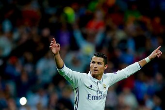 MADRID, SPAIN - SEPTEMBER 14: Cristiano Ronaldo of Real Madrid CF celebrates scoring their opening goal during the UEFA Champions League group stage match between Real Madrid CF and Sporting Clube de Portugal at Santiago Bernabeu stadium  on September 14,