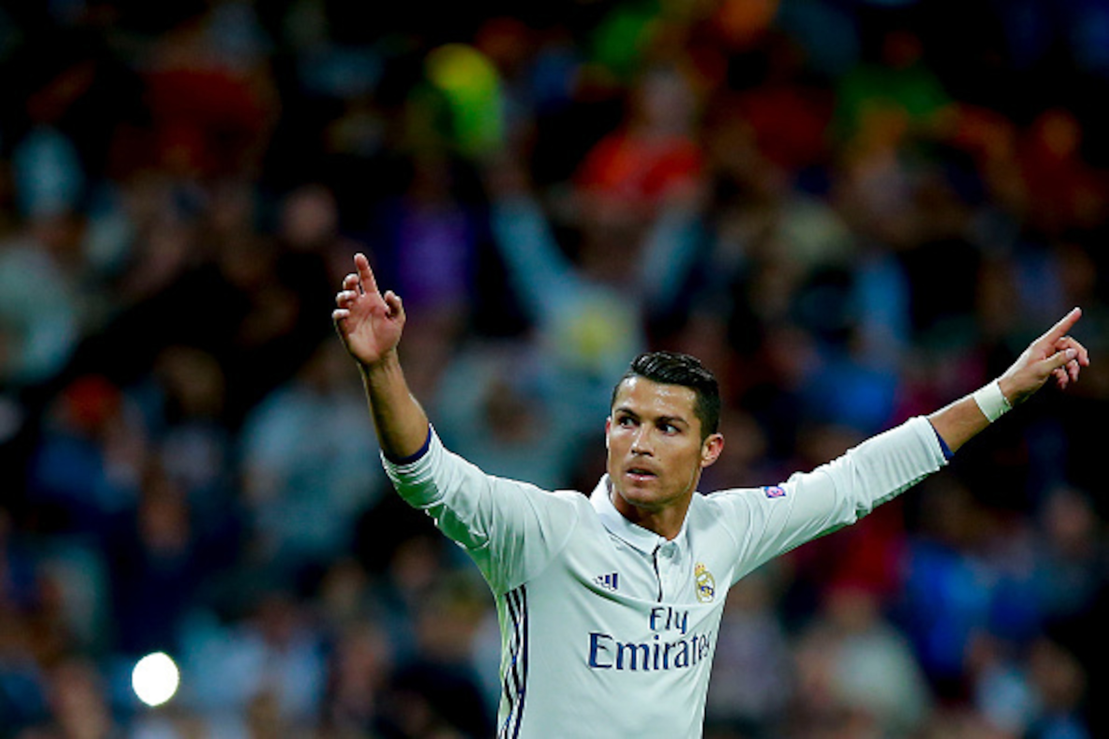 MADRID, SPAIN - SEPTEMBER 14: Cristiano Ronaldo of Real Madrid CF celebrates scoring their opening goal during the UEFA Champions League group stage match between Real Madrid CF and Sporting Clube de Portugal at Santiago Bernabeu stadium on September 14, MADRID, SPAIN - SEPTEMBER 14: Cristiano Ronaldo of Real Madrid CF celebrates scoring their opening goal during the UEFA Champions League group stage match between Real Madrid CF and Sporting Clube de Portugal at Santiago Bernabeu stadium on September 14,