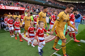 MIDDLESBROUGH, ENGLAND - SEPTEMBER 24:  The Tottenham Hotspur and Middlesbrough teams walk out during the Premier League match between Middlesbrough and Tottenham Hotspur at the Riverside Stadium on September 24, 2016 in Middlesbrough, England.  (Photo by