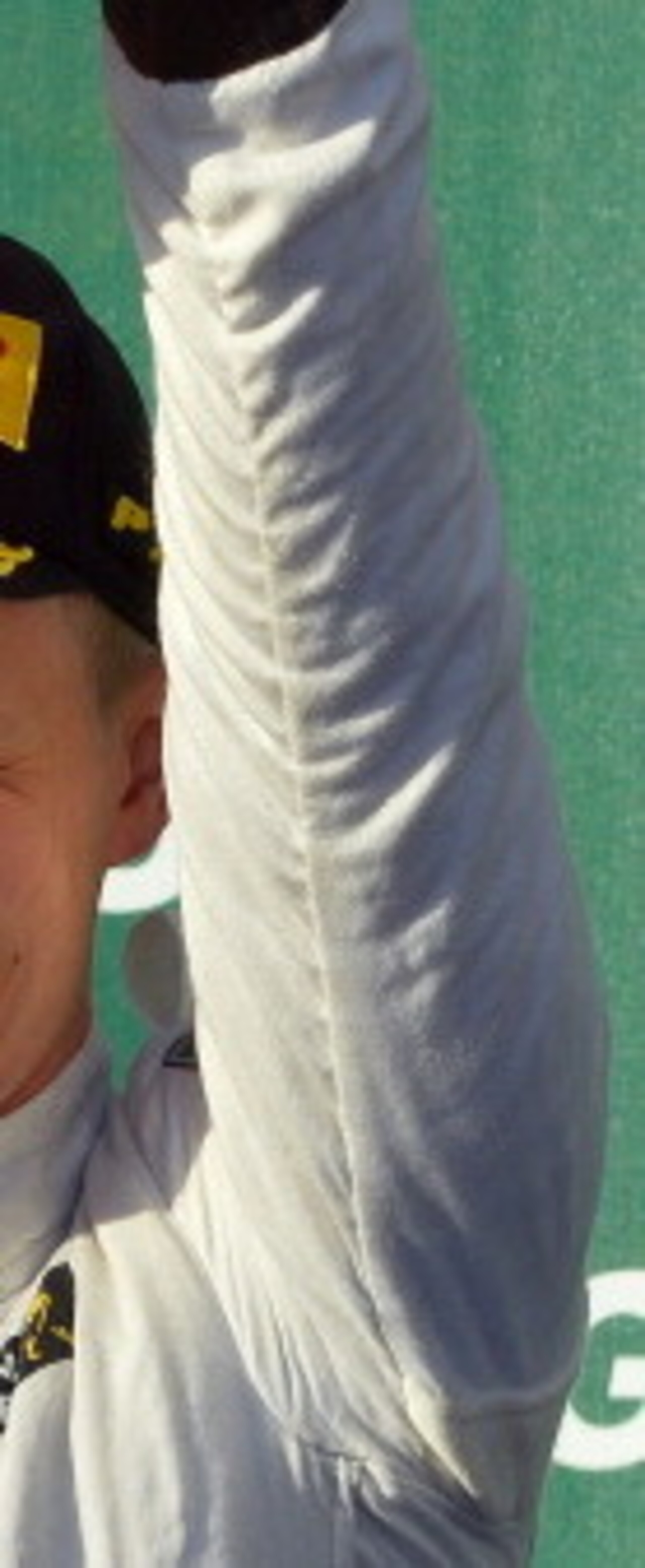 Third-placed McLaren driver Kevin Magnussen of Denmark celebrates on the podium after the Formula One Australian Grand Prix in Melbourne on March 16, 2014.     AFP PHOTO / SAEED KHAN
IMAGE RESTRICTED TO EDITORIAL USE - STRICTLY NO COMMERCIAL USE        (P
