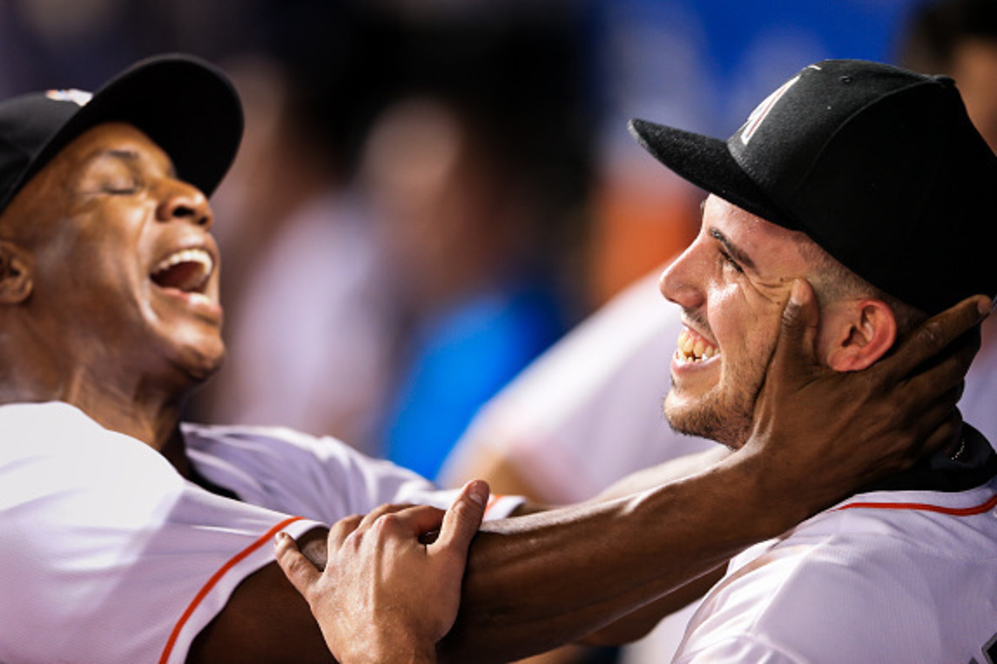 MIAMI, FL - SEPTEMBER 20: Jose Fernandez #16 of the Miami Marlins celebrates in the dugout with hitting coach Barry Bonds during the game against the Washington Nationals at Marlins Park on September 20, 2016 in Miami, Florida. (Photo by Rob Foldy/Getty I