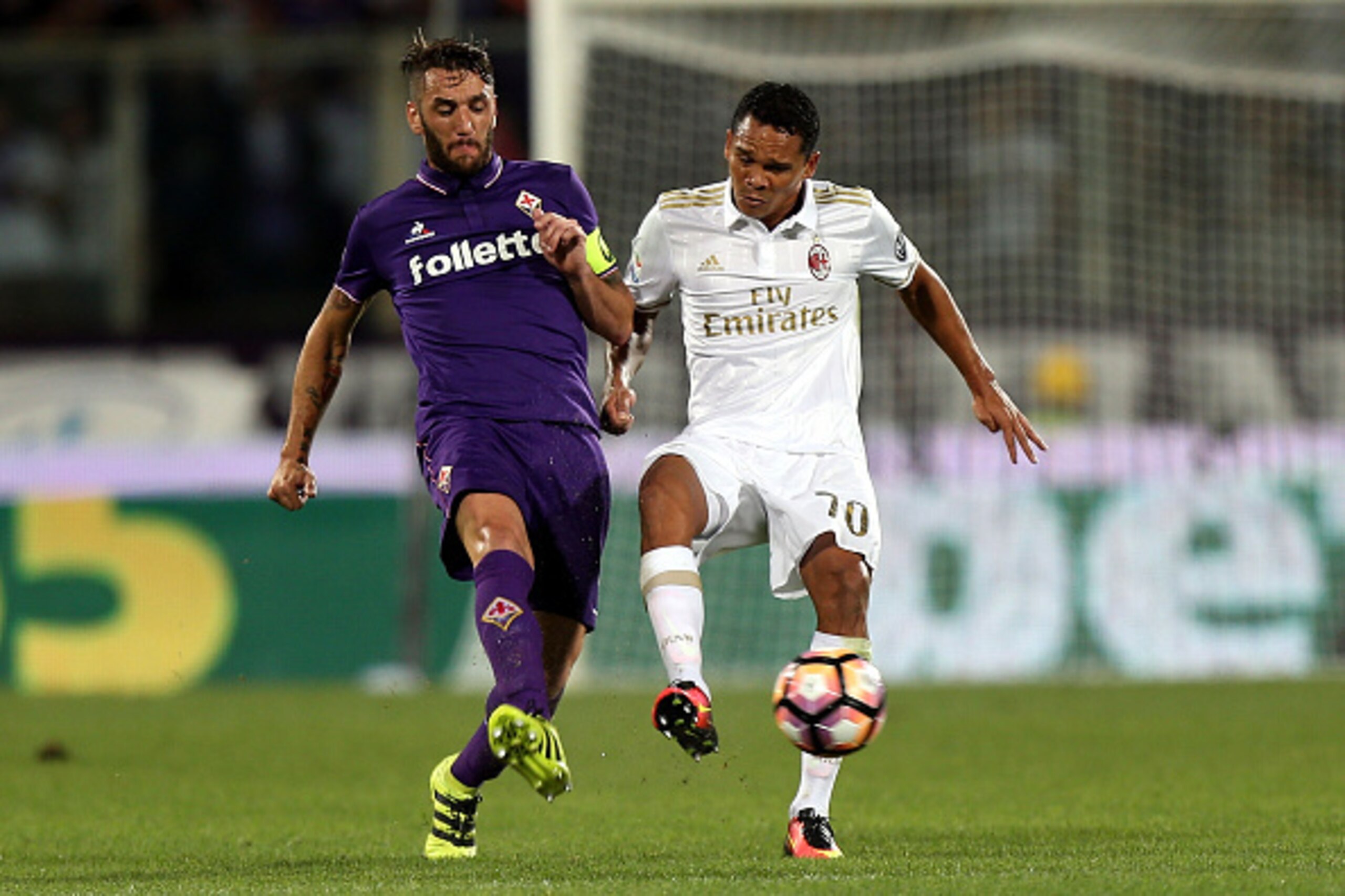 FLORENCE, ITALY - SEPTEMBER 25: Gonzalo Rodriguez of ACF Fiorentina fights for the ball with Carlos Bacca of AC Milan during the Serie A match between ACF Fiorentina and AC Milan at Stadio Artemio Franchi on September 25, 2016 in Florence, Italy. (Photo FLORENCE, ITALY - SEPTEMBER 25: Gonzalo Rodriguez of ACF Fiorentina fights for the ball with Carlos Bacca of AC Milan during the Serie A match between ACF Fiorentina and AC Milan at Stadio Artemio Franchi on September 25, 2016 in Florence, Italy. (Photo