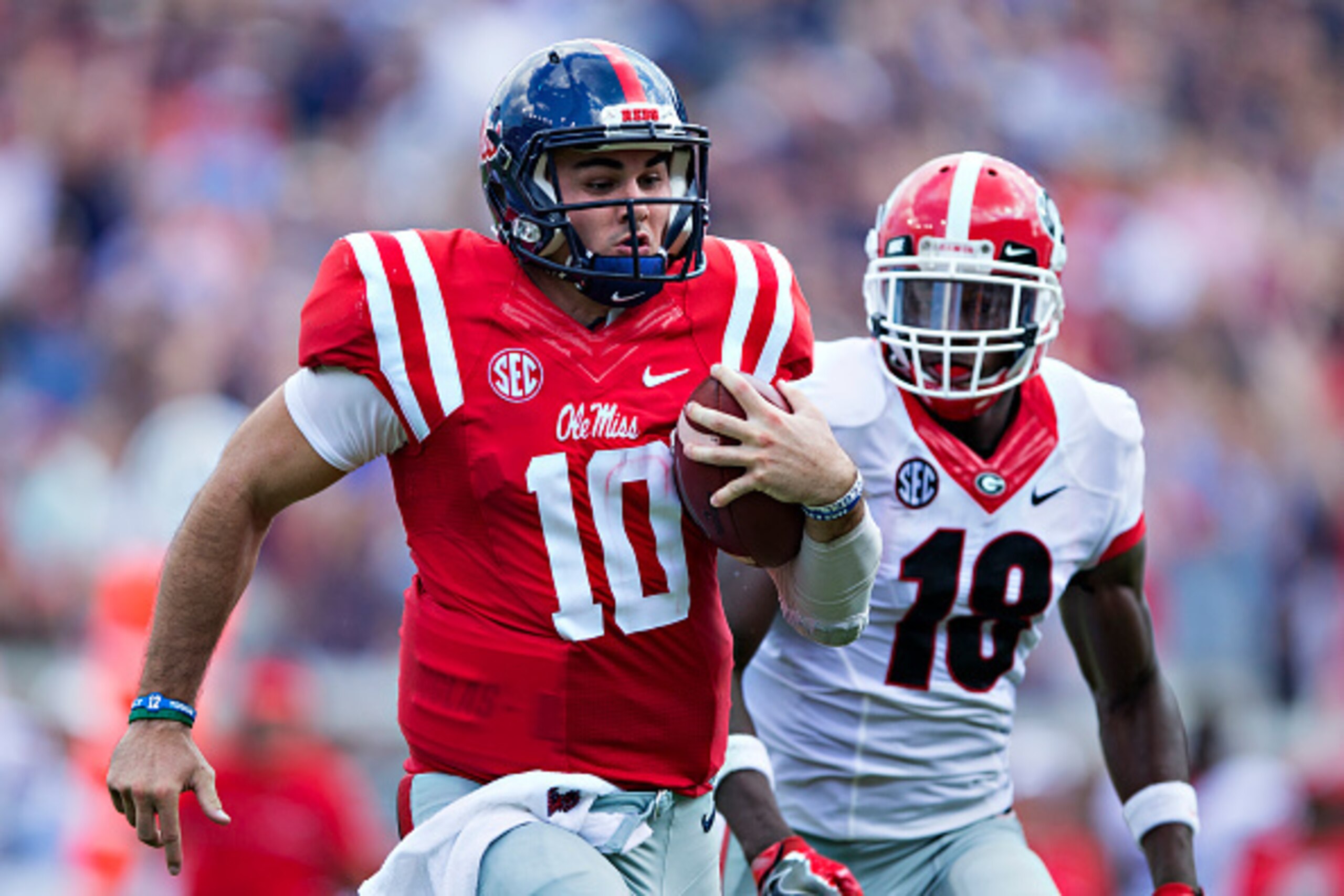 OXFORD, MS - SEPTEMBER 24:  Chad Kelly #10 of the Mississippi Rebels runs for a touchdown against Deandre Baker #18 of the Georgia Bulldogs at Vaught-Hemingway Stadium on September 24, 2016 in Oxford, Mississippi.  The Rebels defeated the Bulldogs 45-14. 