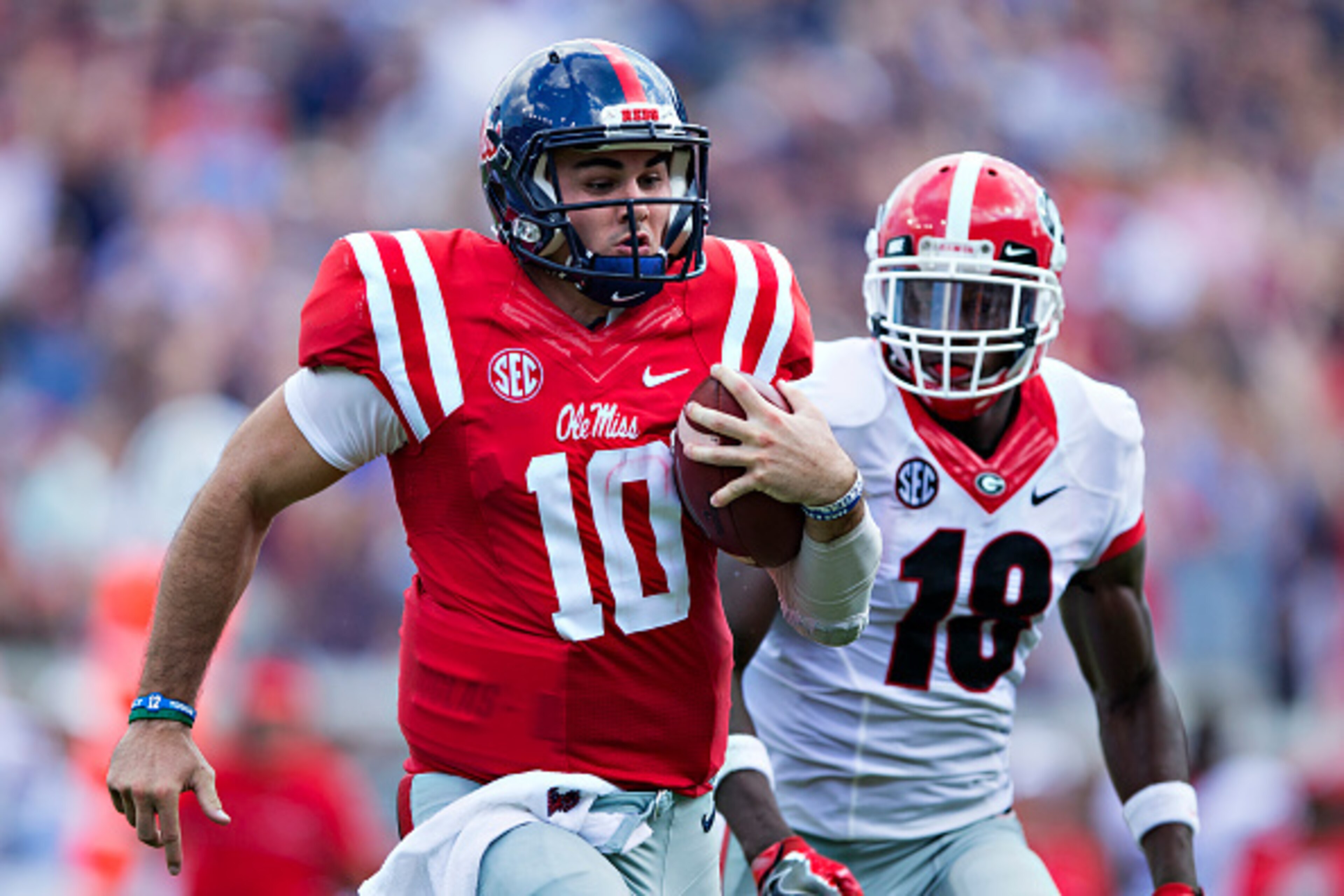 OXFORD, MS - SEPTEMBER 24:  Chad Kelly #10 of the Mississippi Rebels runs for a touchdown against Deandre Baker #18 of the Georgia Bulldogs at Vaught-Hemingway Stadium on September 24, 2016 in Oxford, Mississippi.  The Rebels defeated the Bulldogs 45-14. 
