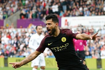 Manchester City's Argentinian striker Sergio Aguero celerbates scoring the opening goal during the English Premier League football match between Swansea City and Manchester City at The Liberty Stadium in Swansea, south Wales on September 24, 2016. / AFP /