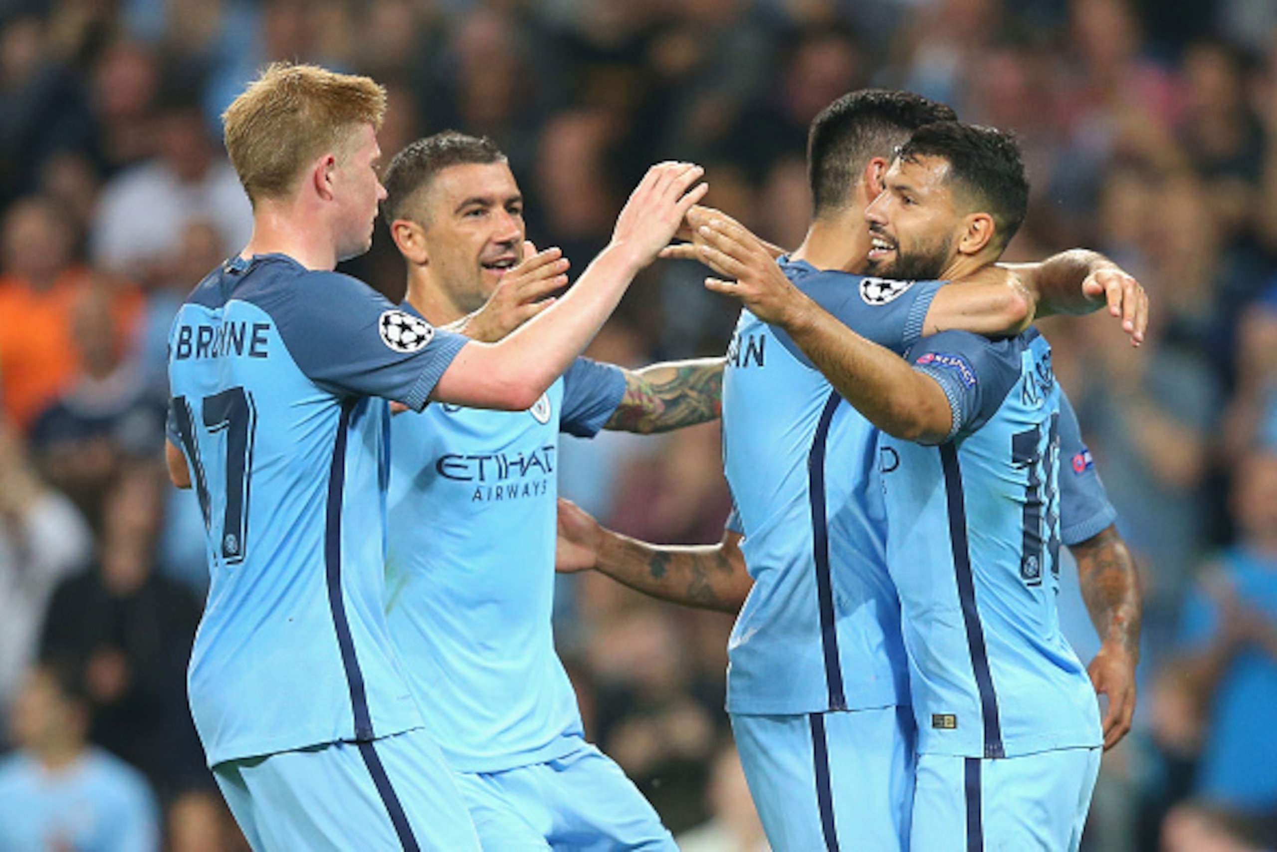 MANCHESTER, ENGLAND - SEPTEMBER 14: Sergio Aguero of Manchester City celebrates with team-mates after scoring his second during the UEFA Champions League match between Manchester City FC and VfL Borussia Moenchengladbach at Etihad Stadium on September 14,