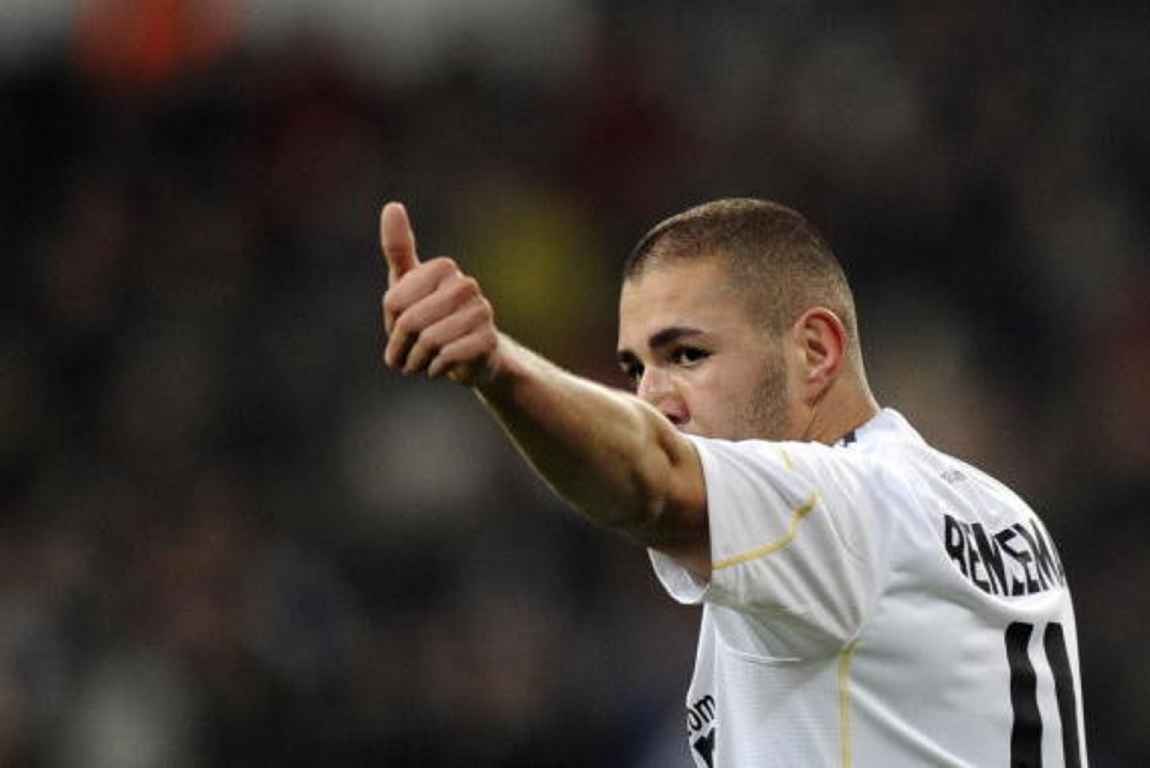 Real Madrid's French forward Karim Benzema celebrates after scoring  against Almeria during a Spanish league football match at Santiago Bernabeu stadium on December 5, 2009.  AFP PHOTO/JAVIER SORIANO (Photo credit should read JAVIER SORIANO/AFP/Getty Imag