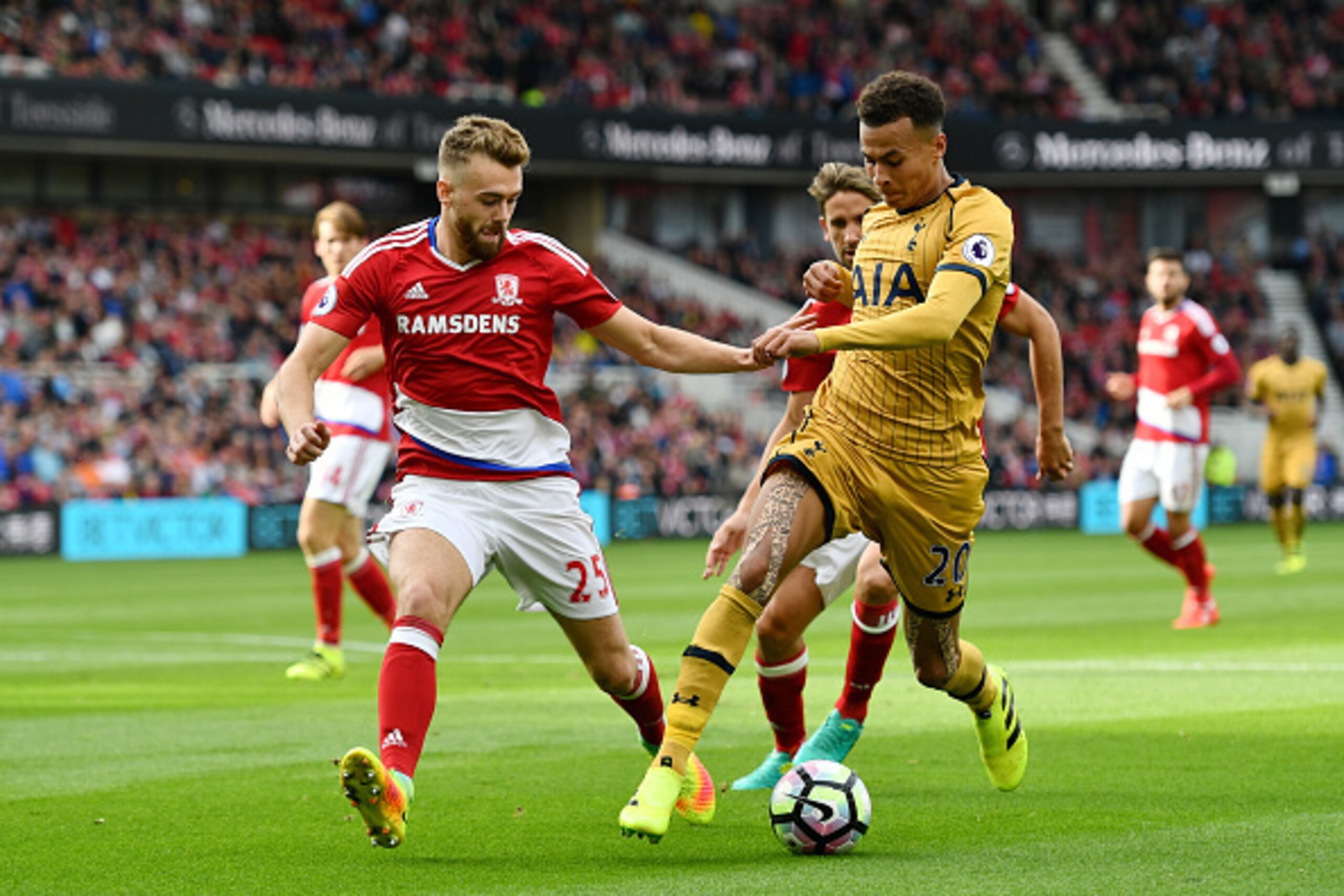 MIDDLESBROUGH, ENGLAND - SEPTEMBER 24:  Calum Chambers of Middlesbrough (L) and Dele Alli of Tottenham Hotspur (R) battle for possession during the Premier League match between Middlesbrough and Tottenham Hotspur at the Riverside Stadium on September 24, 
