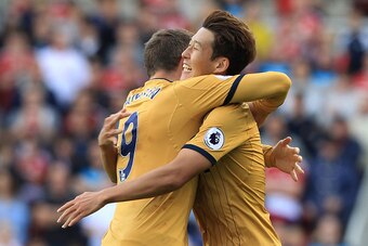 Tottenham Hotspur's South Korean striker Son Heung-Min (R) celebrates with Tottenham Hotspur's Dutch striker Vincent Janssen after scoring his team's first goal during the English Premier League football match between Middlesbrough and Tottenham Hotspur a