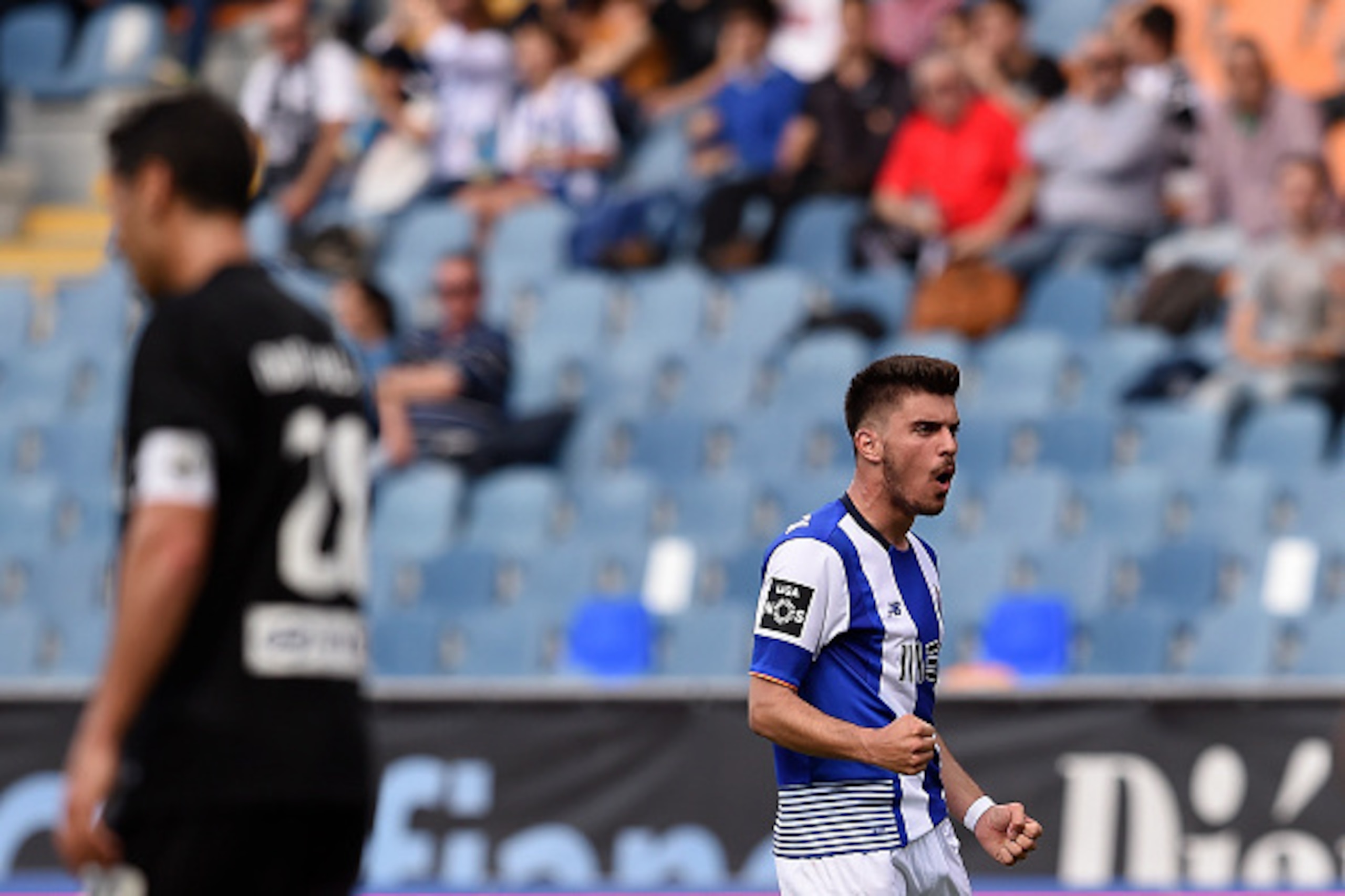Porto's midfielder Ruben Neves celebrates after scoring a goal during the Portuguese league football match Associacao Academica de Coimbra vs FC Porto at the Coimbra City stadium in Coimbra on April 23, 2016. / AFP / FRANCISCO LEONG        (Photo credit s
