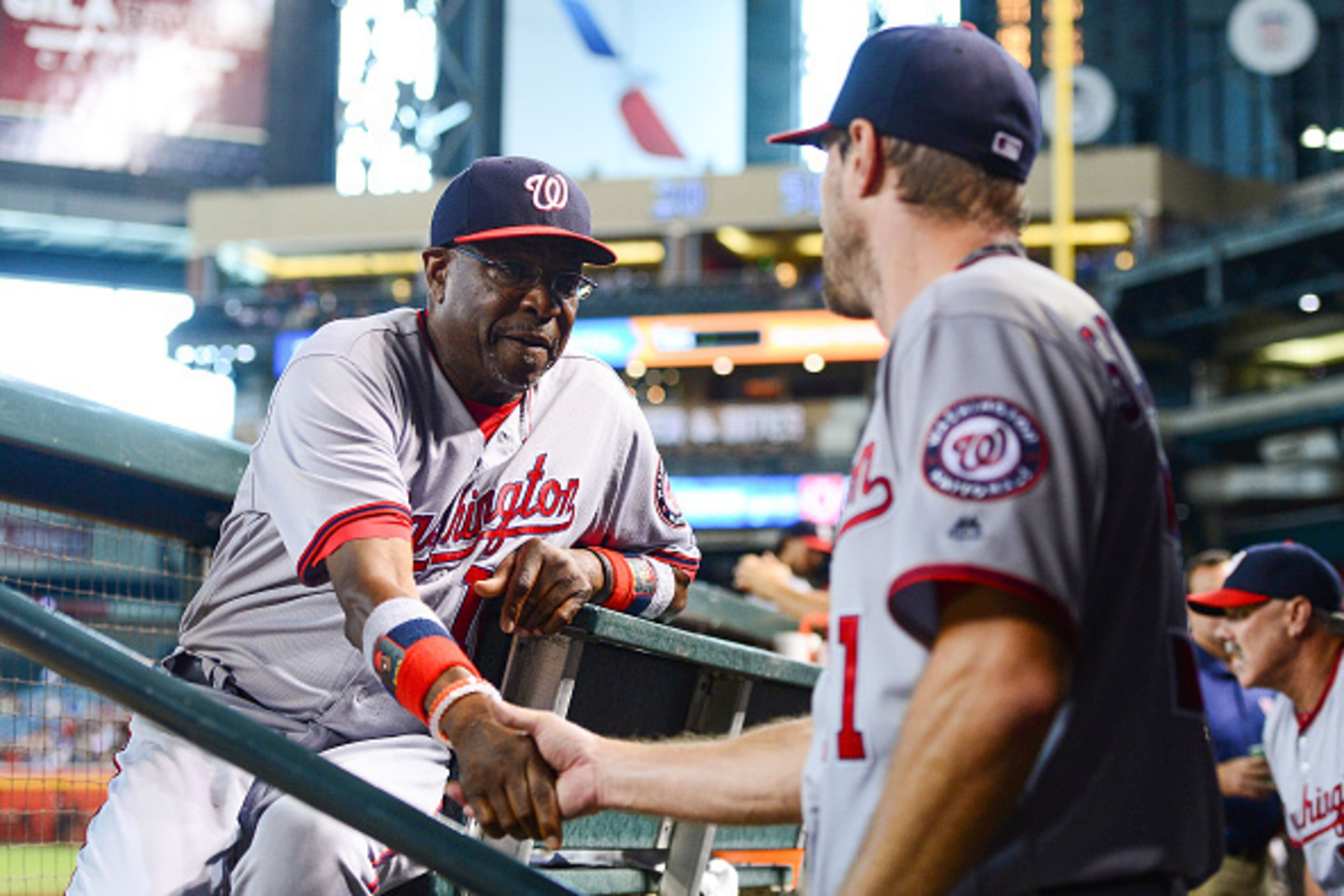 PHOENIX, AZ - AUGUST 03: Manager Dusty Baker #12 of the Washington Nationals shakes hands with Max Scherzer #31 after Scherzer closed out the eight inning against the Arizona Diamondbacks at Chase Field on August 3, 2016 in Phoenix, Arizona. (Photo by J PHOENIX, AZ - AUGUST 03: Manager Dusty Baker #12 of the Washington Nationals shakes hands with Max Scherzer #31 after Scherzer closed out the eight inning against the Arizona Diamondbacks at Chase Field on August 3, 2016 in Phoenix, Arizona. (Photo by J