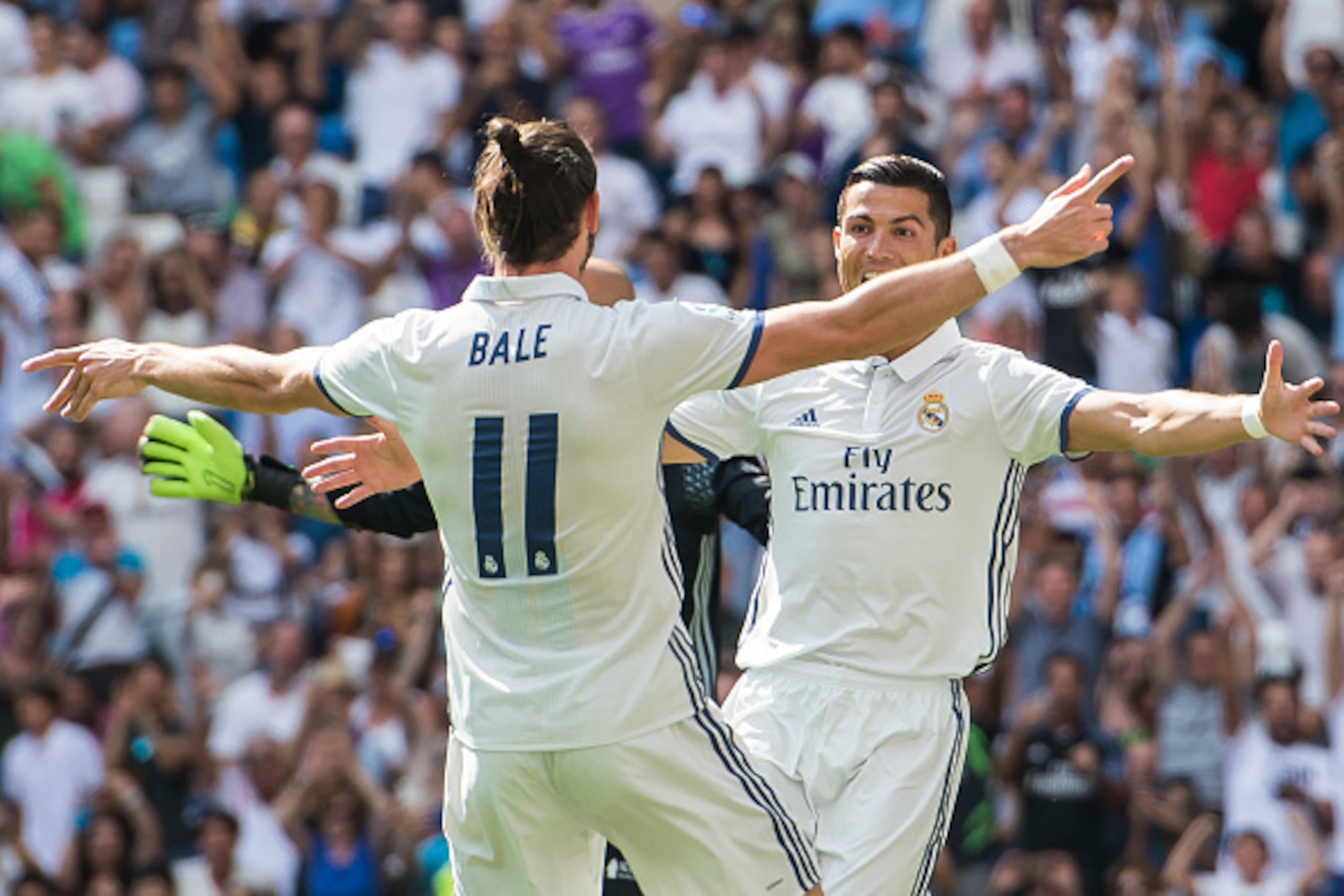 MADRID - SEPTEMBER 10: Cristiano Ronaldo of Real Madrid celebrates with teammate Gareth Bale during the La Liga match between Real Madrid and Osasuna at the Santiago Bernabeu Stadium on 10 September 2016 in Madrid, Spain. (Photo by Power Sport Images/Gett