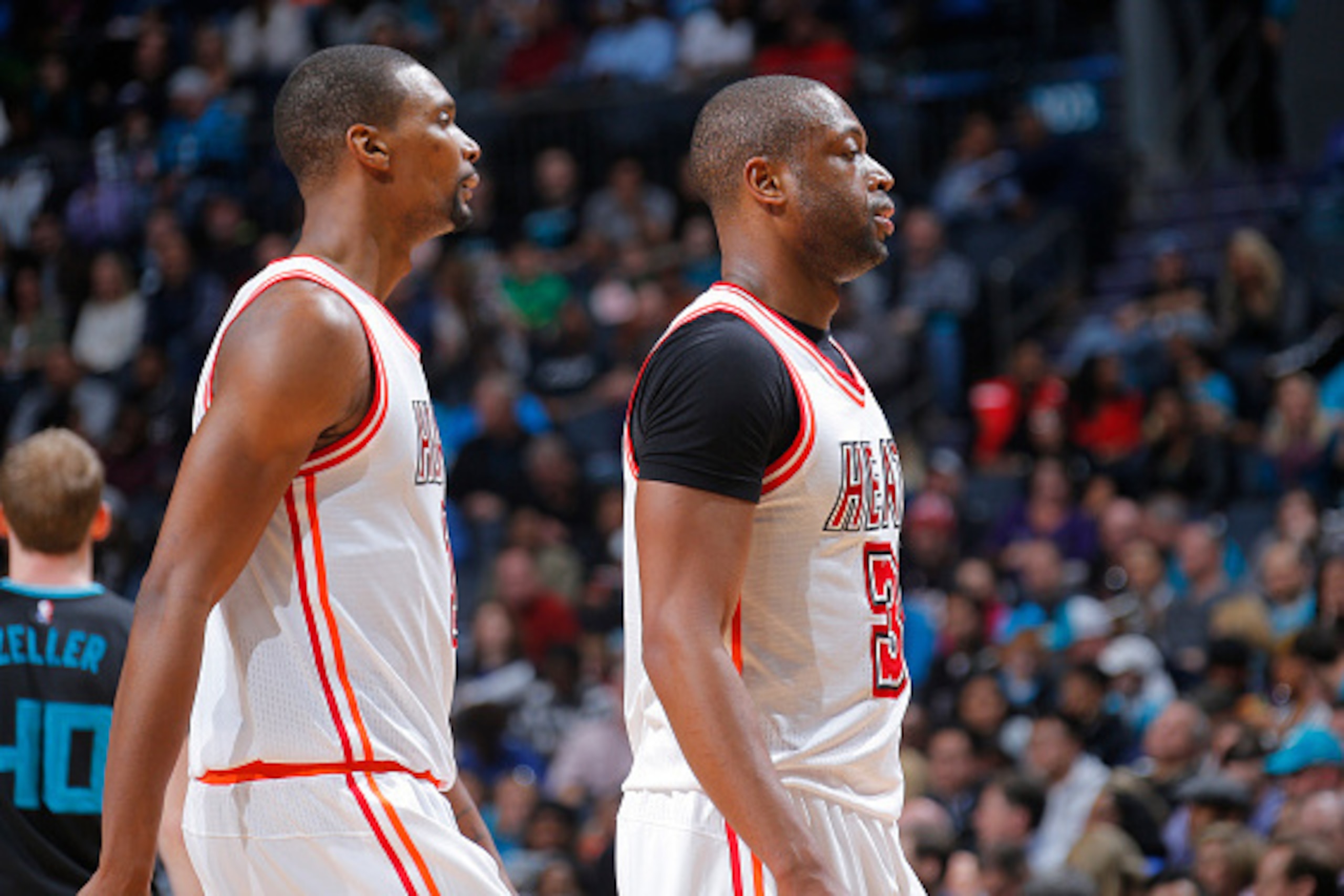 CHARLOTTE, NC - FEBRUARY 5: Chris Bosh #1 and Dwyane Wade #3 of the Miami Heat look on during the game against the Charlotte Hornets on February 5, 2016 at Time Warner Cable Arena in Charlotte, North Carolina. NOTE TO USER: User expressly acknowledges and CHARLOTTE, NC - FEBRUARY 5: Chris Bosh #1 and Dwyane Wade #3 of the Miami Heat look on during the game against the Charlotte Hornets on February 5, 2016 at Time Warner Cable Arena in Charlotte, North Carolina. NOTE TO USER: User expressly acknowledges and