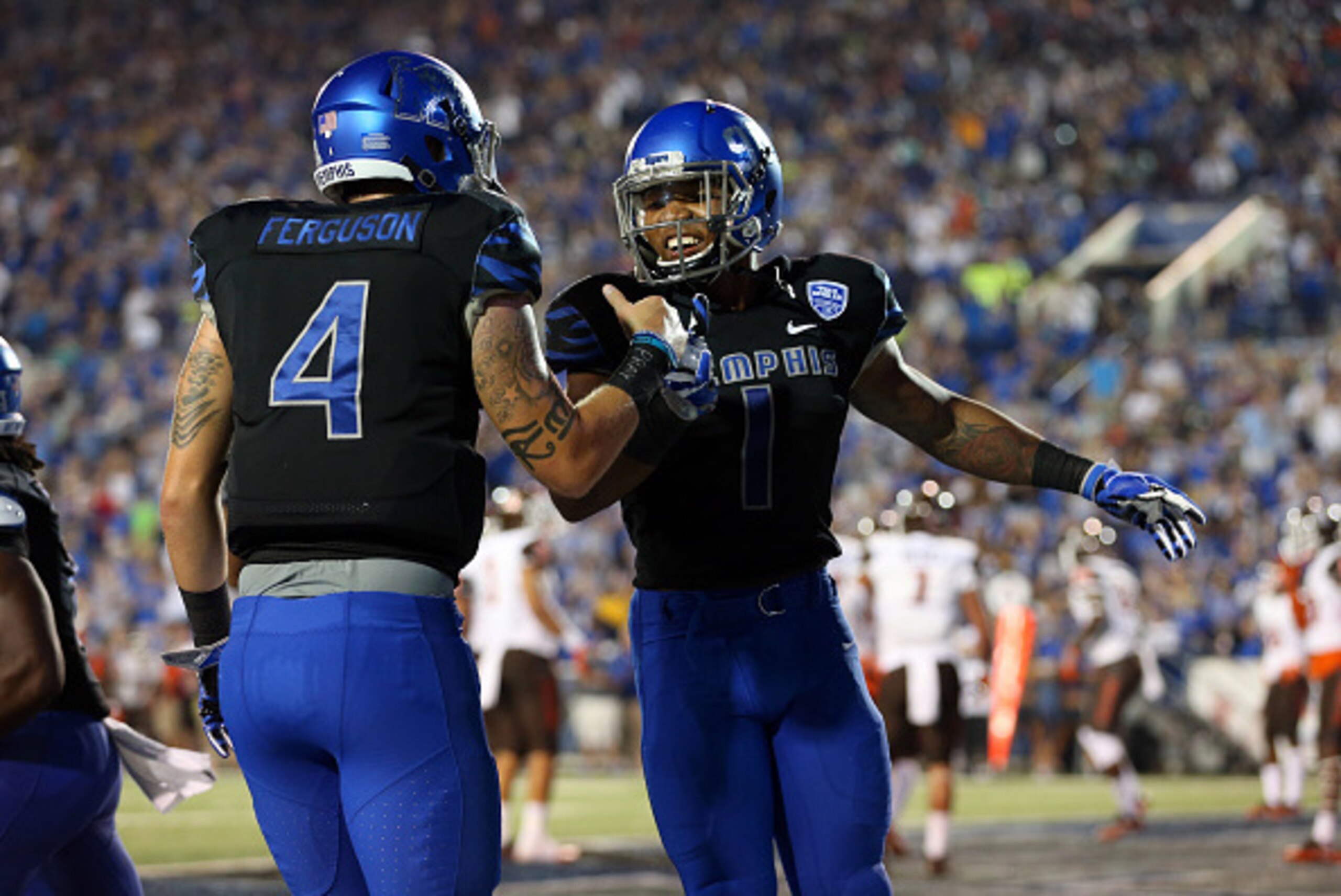 MEMPHIS, TN -SEPTEMBER 24: Tony Pollard #1 of the Memphis Tigers celebrates his touchdown with Riley Ferguson #4 of the Memphis Tigers against the Bowling Green Falcons on September 24, 2016 at Liberty Bowl Memorial Stadium in Memphis, Tennessee. Memphis 