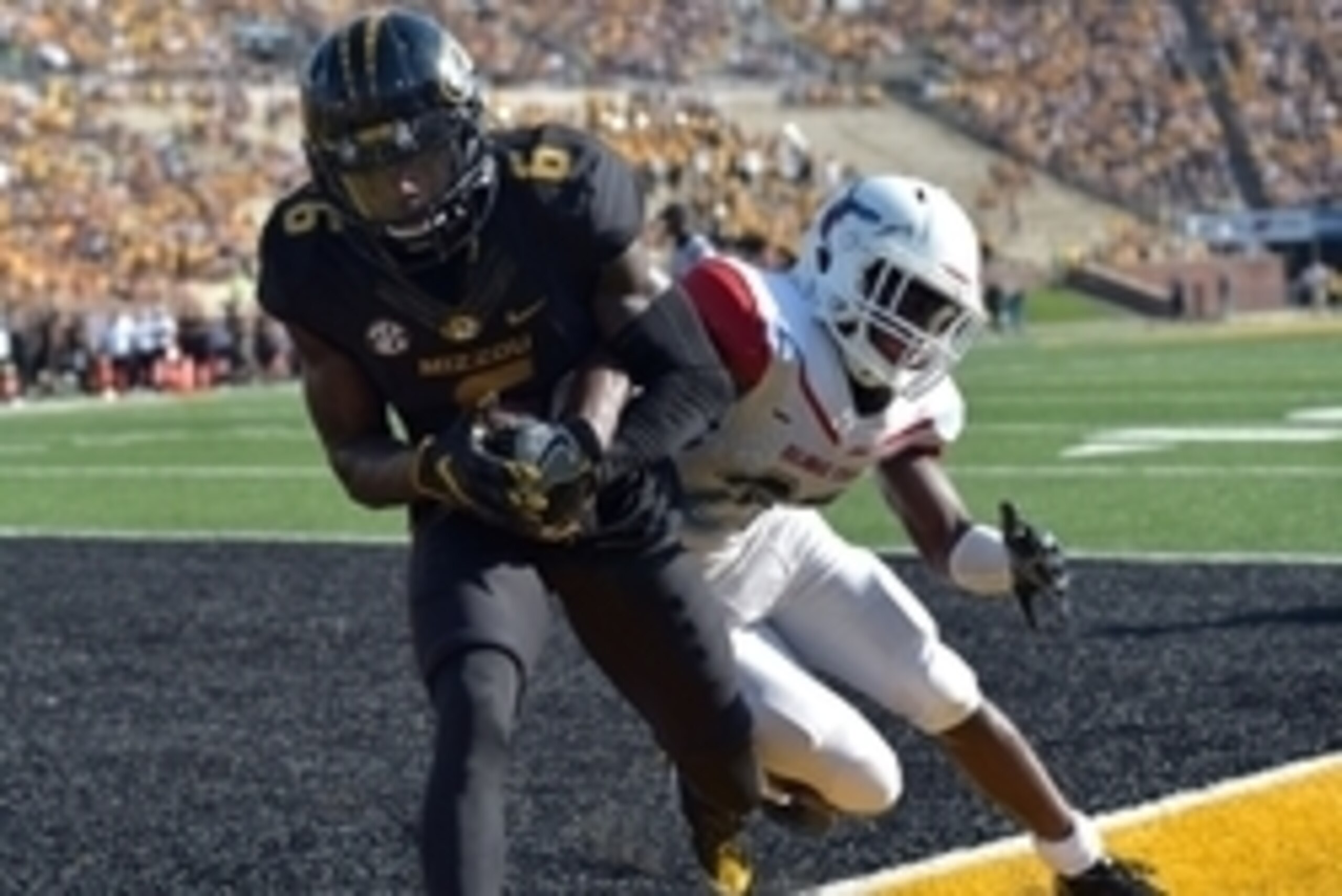 Sep 24, 2016; Columbia, MO, USA; Missouri Tigers wide receiver J'Mon Moore (6) catches a pass for a touchdown as Delaware State Hornets defensive back Keyjuan Selby (20) defends during the first half at Faurot Field. Mandatory Credit: Denny Medley-USA TOD