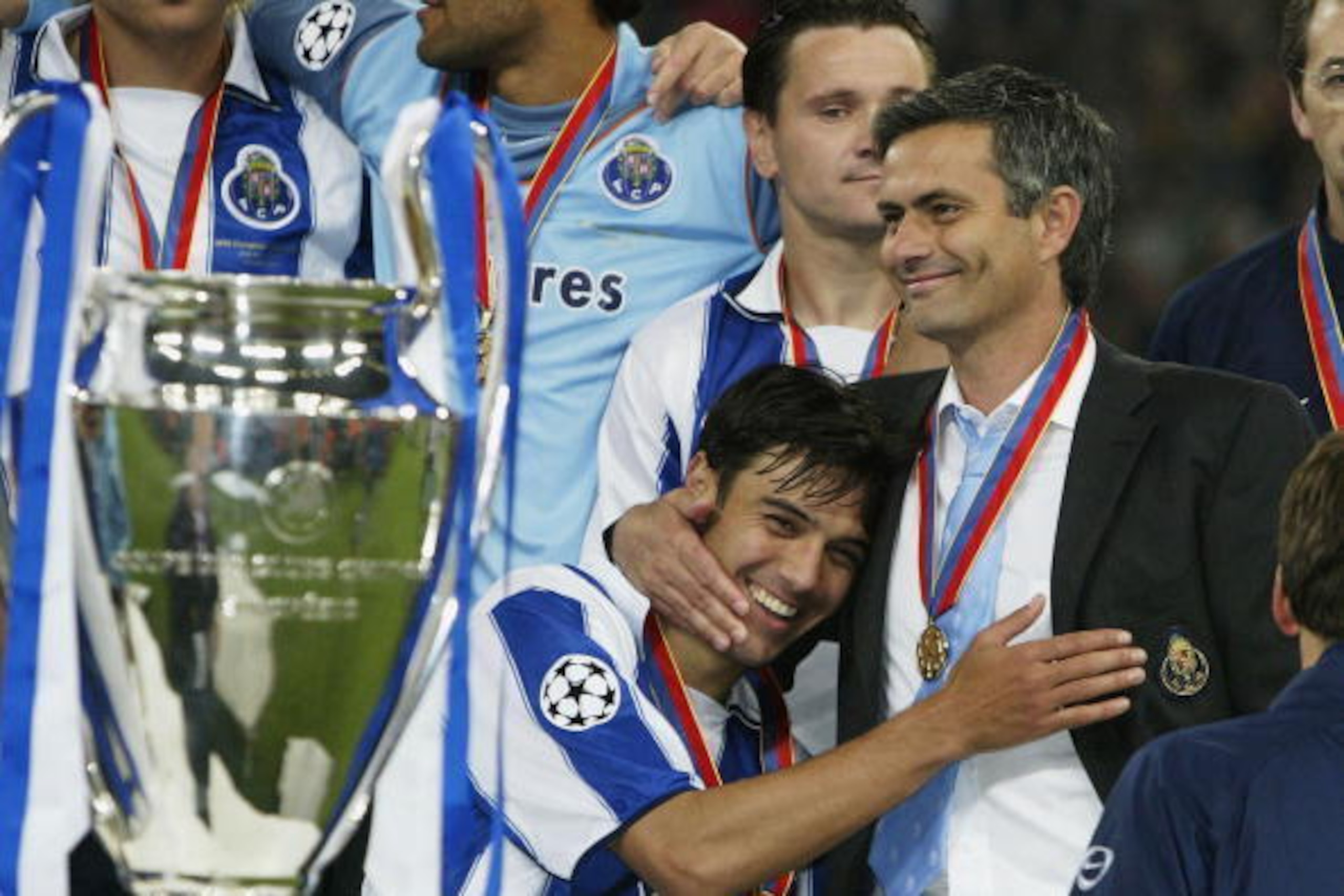 GELSENKIRCHEN, GERMANY - MAY 26:  Nuno Valente of FC Porto hugs his manager Jose Dos Santos Mourinho after winning the Champions League during the UEFA Champions League Final match between AS Monaco and FC Porto at the AufSchake Arena on May 26, 2004 in G