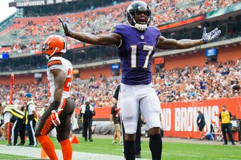 CLEVELAND, OH - SEPTEMBER 18: Wide receiver Mike Wallace #17 of the Baltimore Ravens celebrates after catching a 17 yard touchdown pass from quarterback Joe Flacco #5 during the third quarter against the Cleveland Browns at FirstEnergy Stadium on Septembe