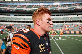 CINCINNATI, OH - SEPTEMBER 25:  Andy Dalton #14 of the Cincinnati Bengals walks off of the field after being defeated by Denver Broncos 29-17 at Paul Brown Stadium on September 25, 2016 in Cincinnati, Ohio. (Photo by Joe Robbins/Getty Images)